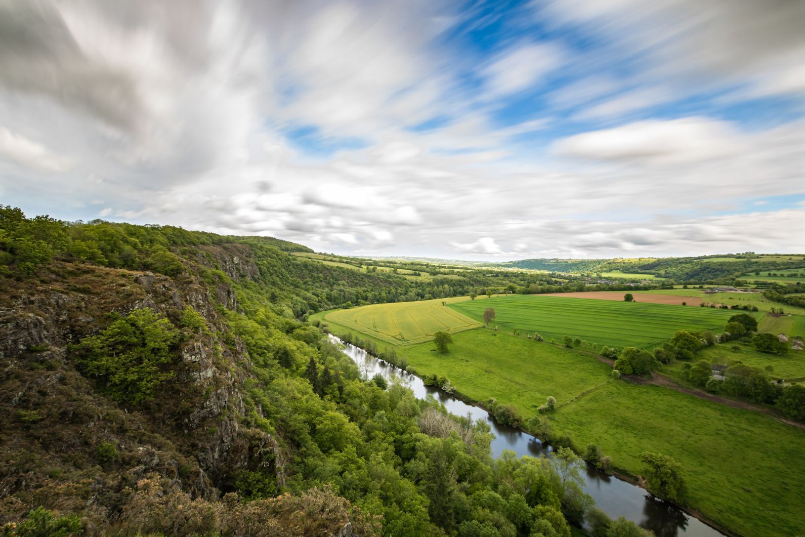 The landscape from the top of Rochers des Parcs on the edge of the Orne River, Northern France.