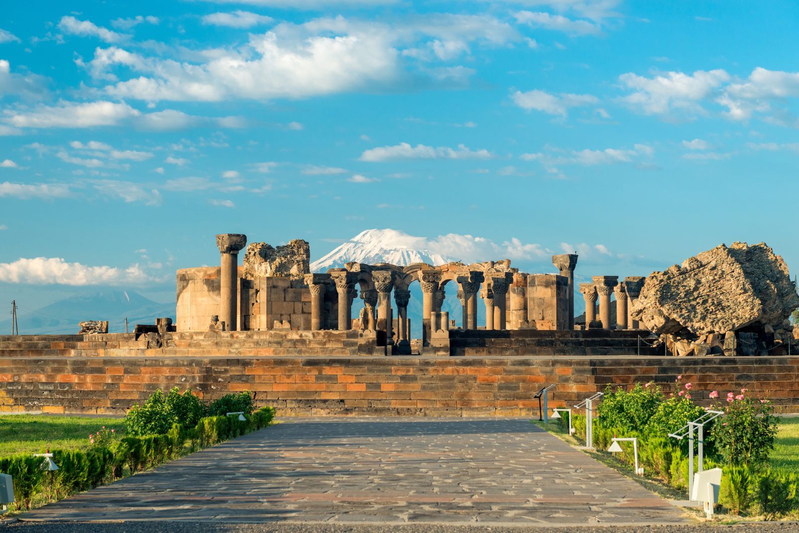 The Zvartnots Cathedral, now in ruins, at the edge of the city of Etchmiadzin, with Ararat in the background