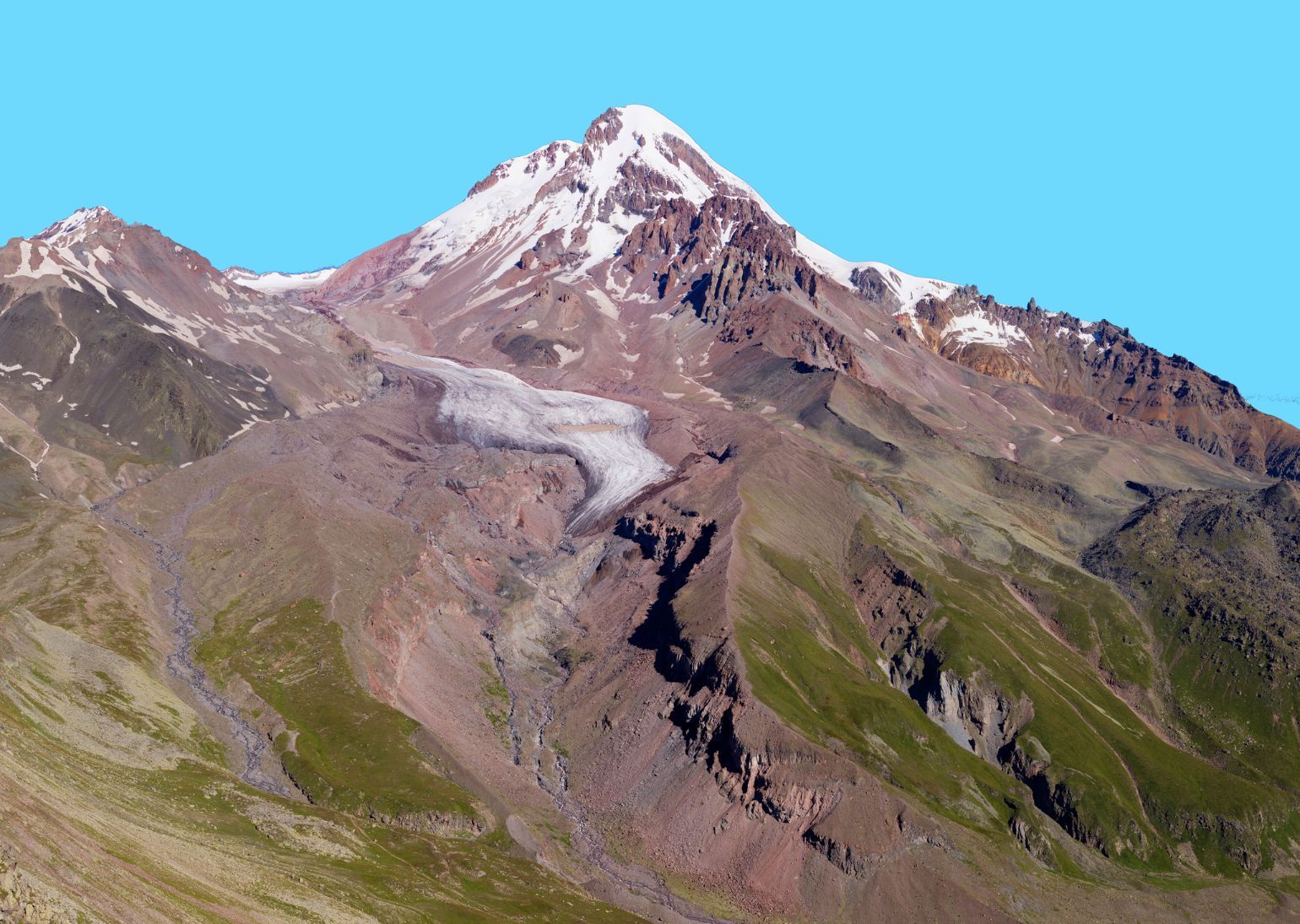 The snow covered slopes of volcanic Mount Kazbek, in Georgia.