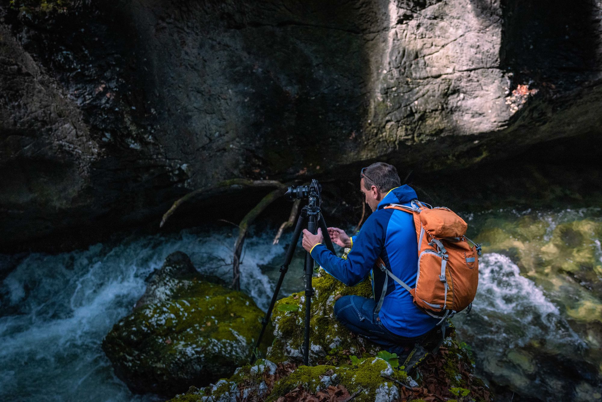 Aleš setting up a shot on a precarious looking rock in the Mostnica Gorge. Photo: Jonathan Kemeys