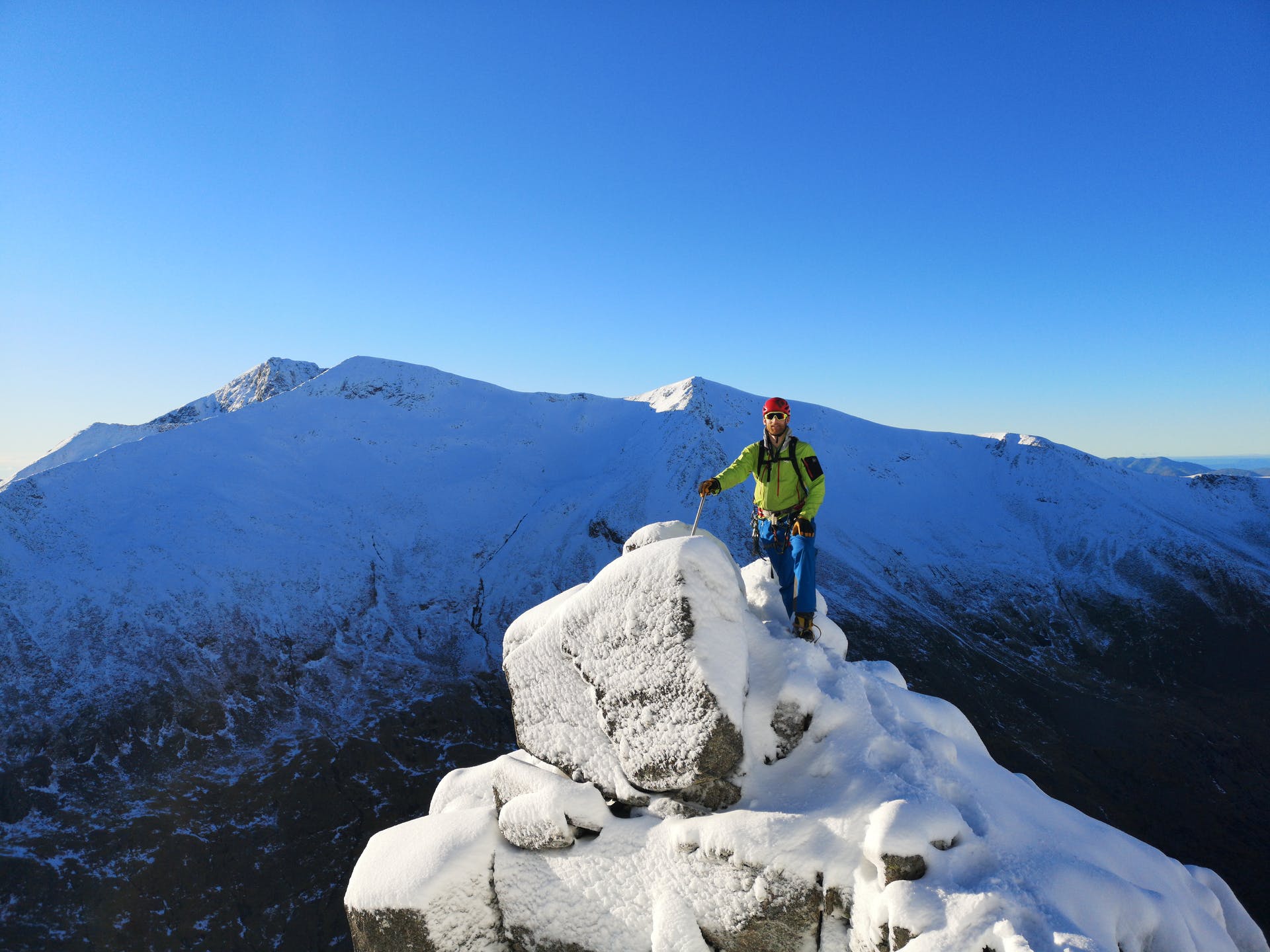 A mountaineer on the snow of Ben Nevis in winter.