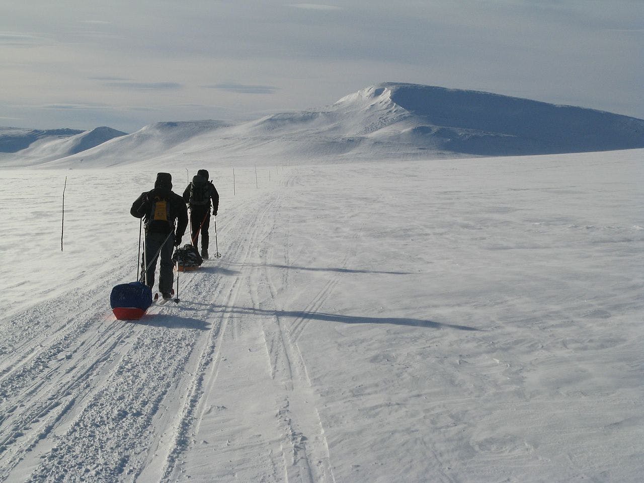 Two cross country skiers in the Arctic Circle.