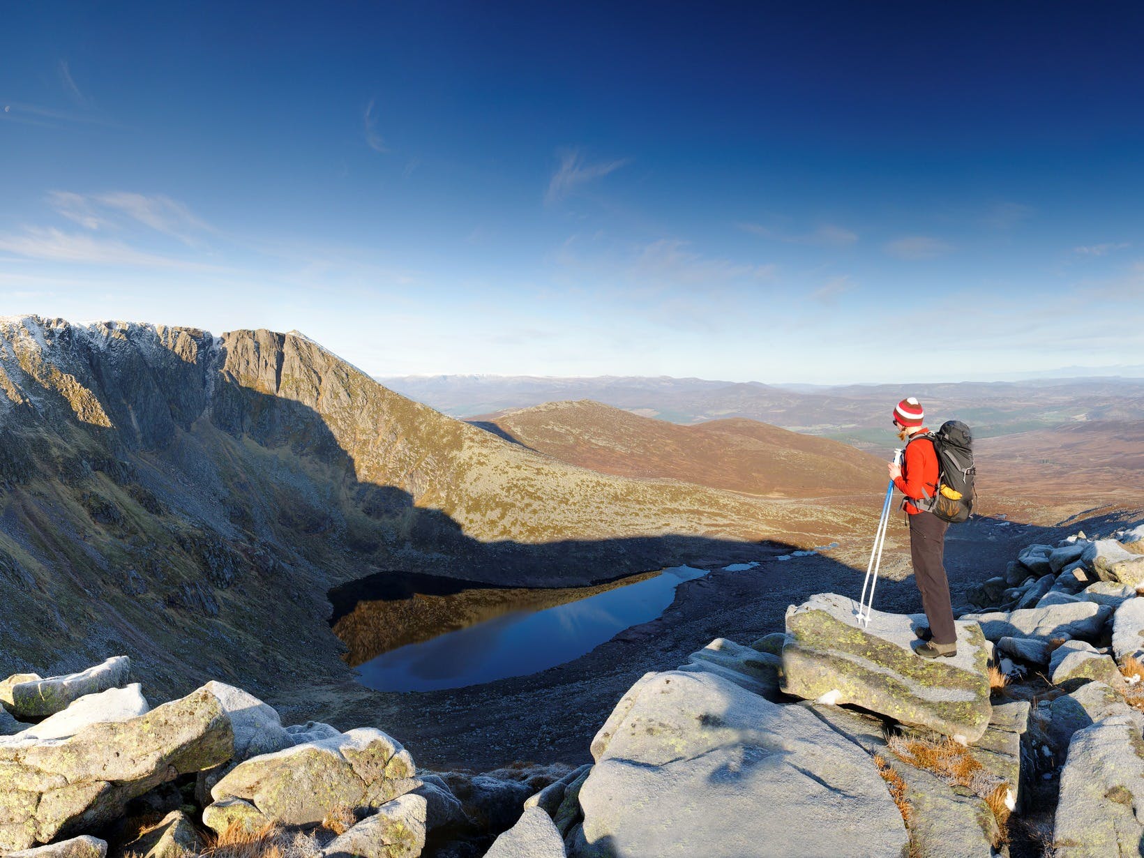 Hiker overlooking views of the Cairngorms