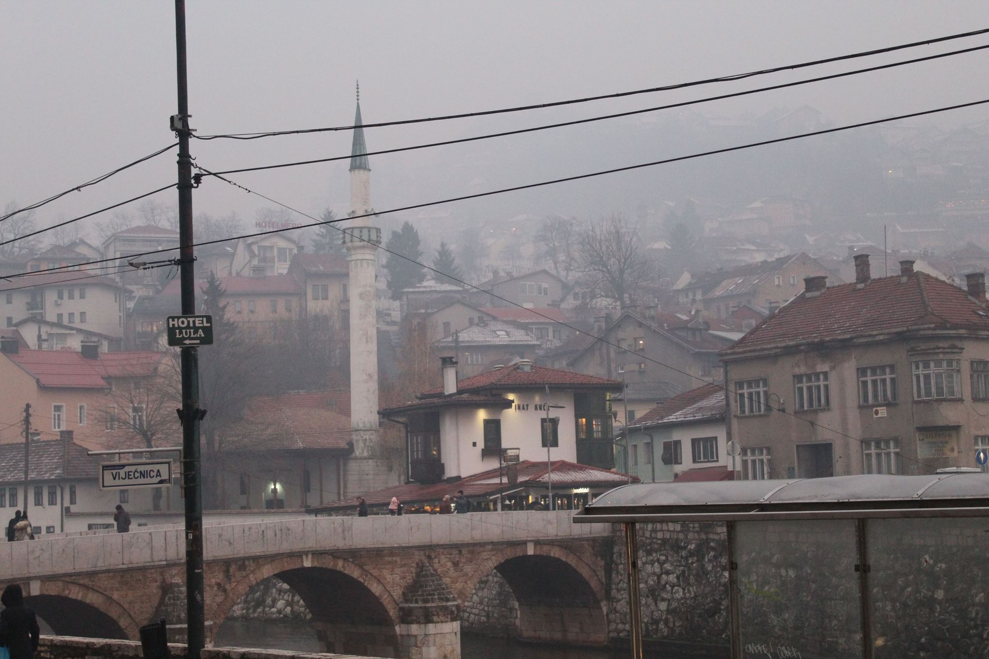 Looking into the old town of Sarajevo, across the Miljacka River and the Latin Bridge.