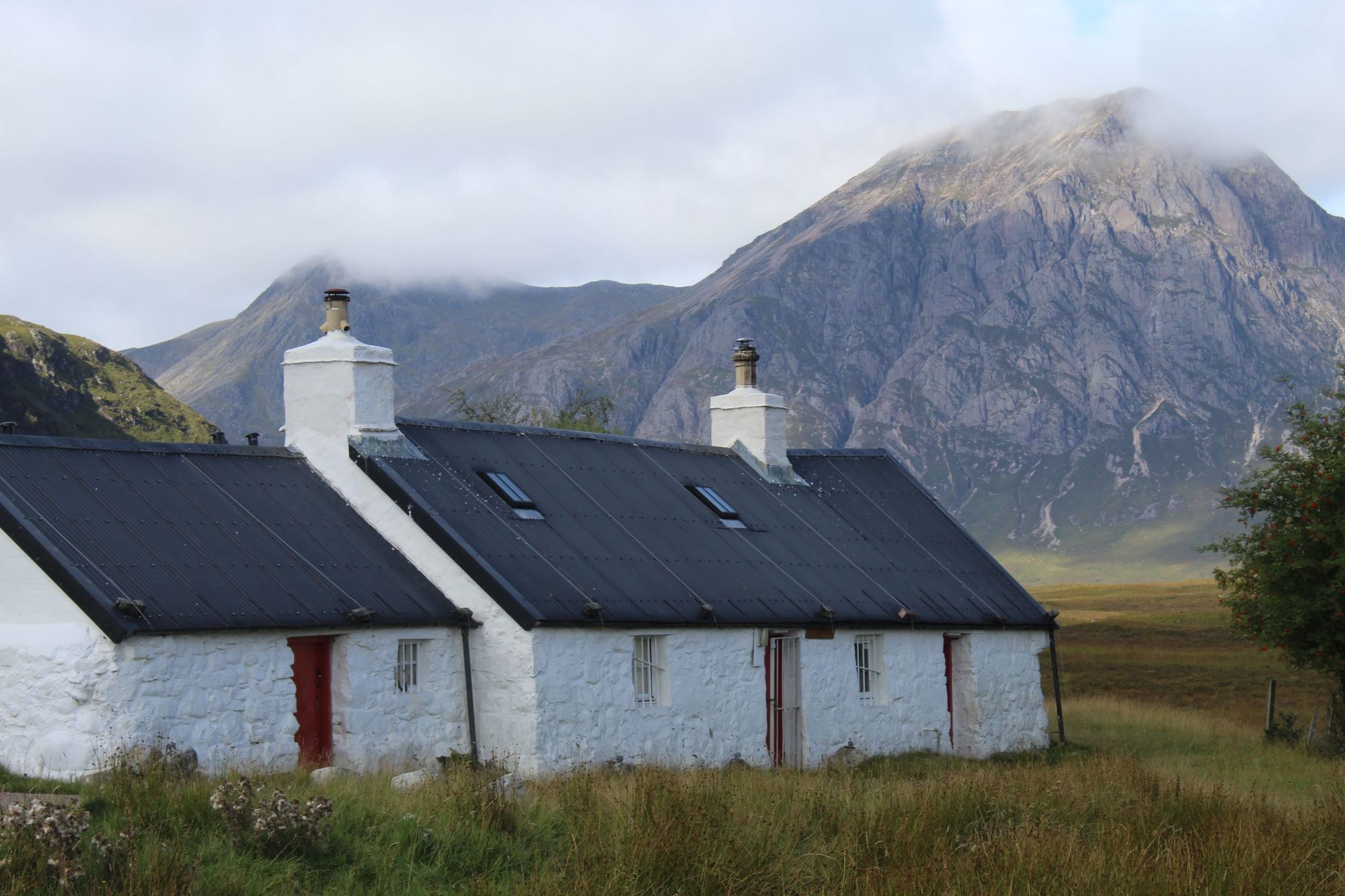 Blackrock Cottage is in the foreground, and the mountain of Buachaille Etive Mòr in the background