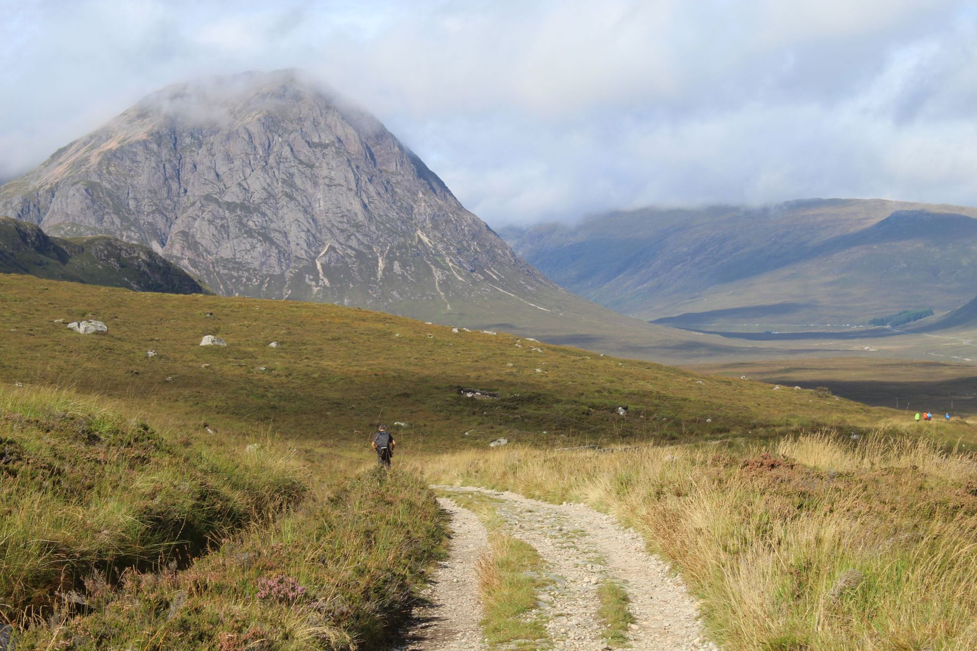 Hiker on the road from Buachaille Etive Mòr, descending down from Rannoch Moor