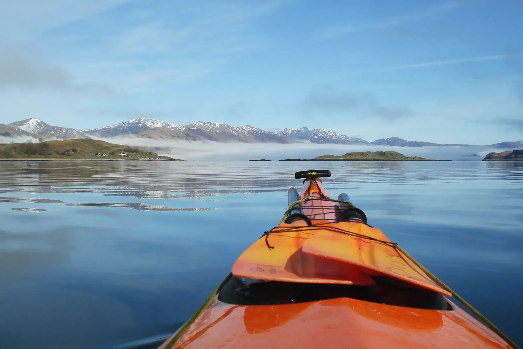 A kayak on the water in the West Highlands of Scotland
