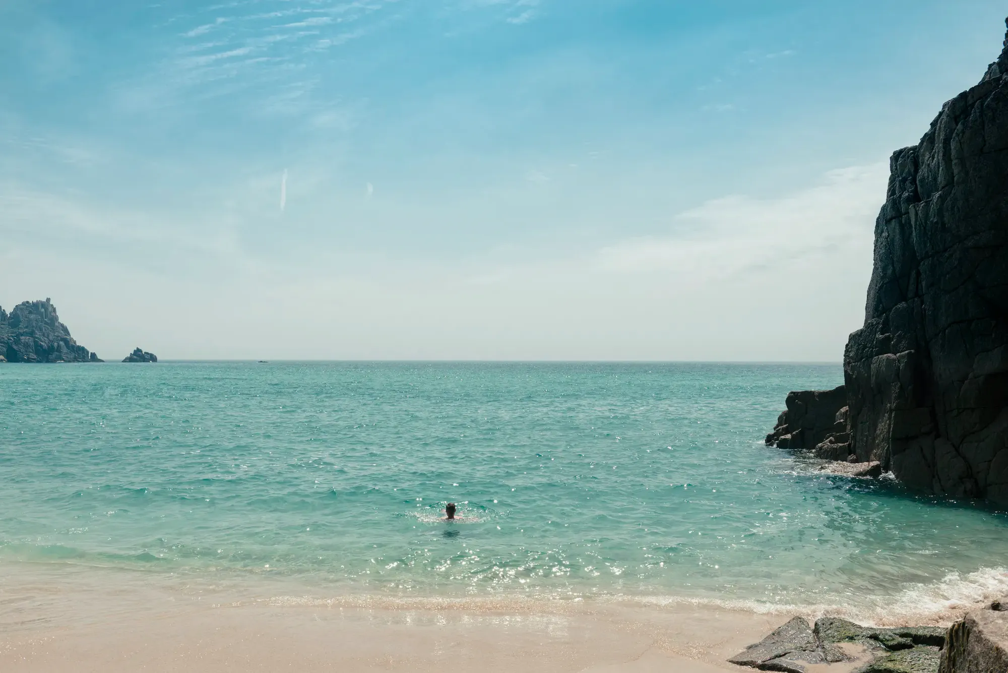 Swimmer in the sea on a Cornish beach