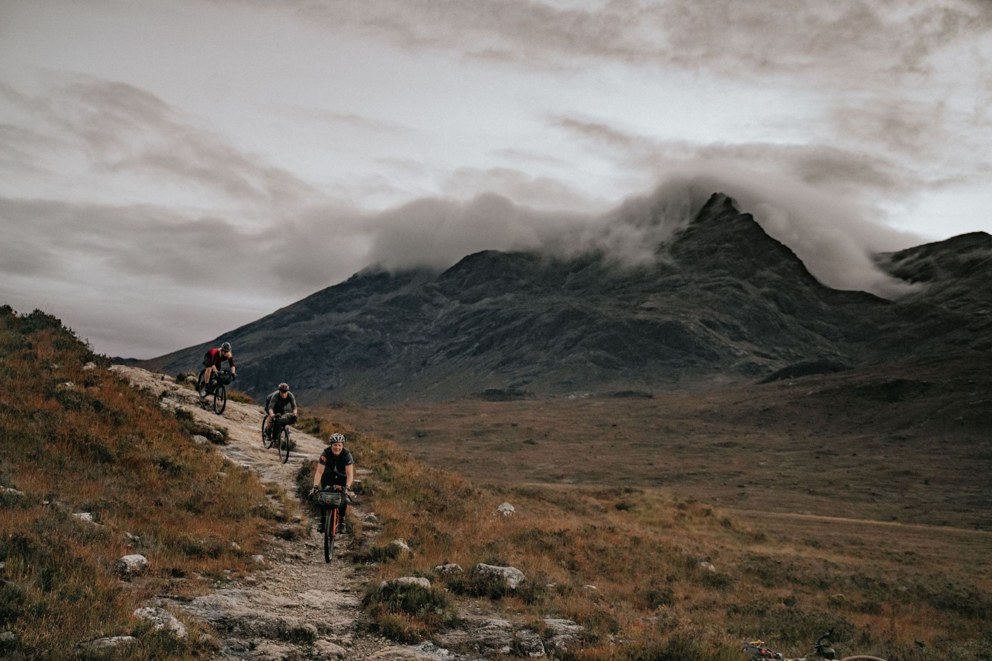 Lee Craigie, Alice Lemkes and Phillipa Battye of the Adventure Syndicate, mountain biking in the Scottish Highlands.