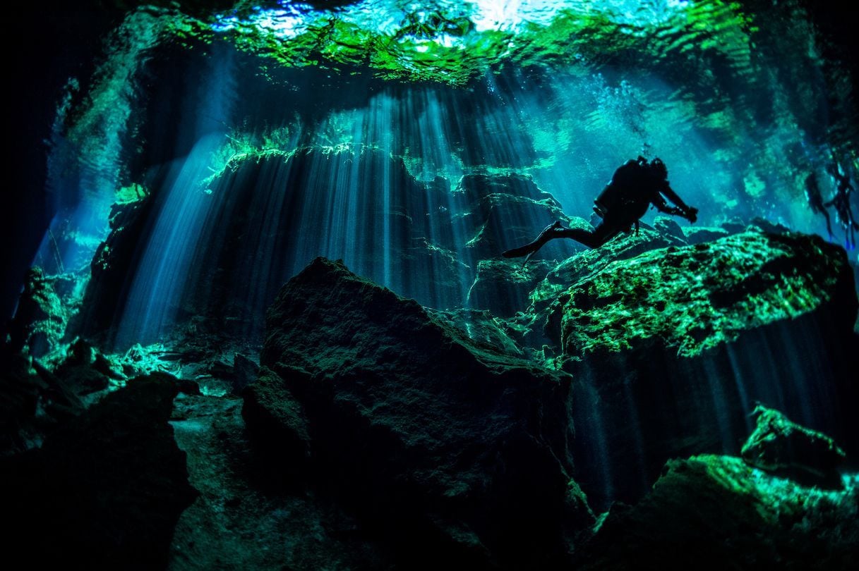 A diver in Cenote Ik Kil, in the Yucatan Peninsula of Mexico