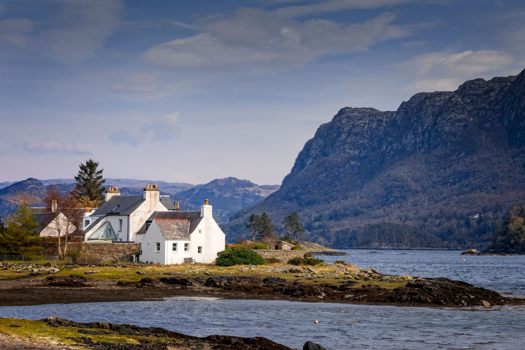 A coastal scene in Plockton, a stop on the Kyle of Lochalsh Line best trains in scotland