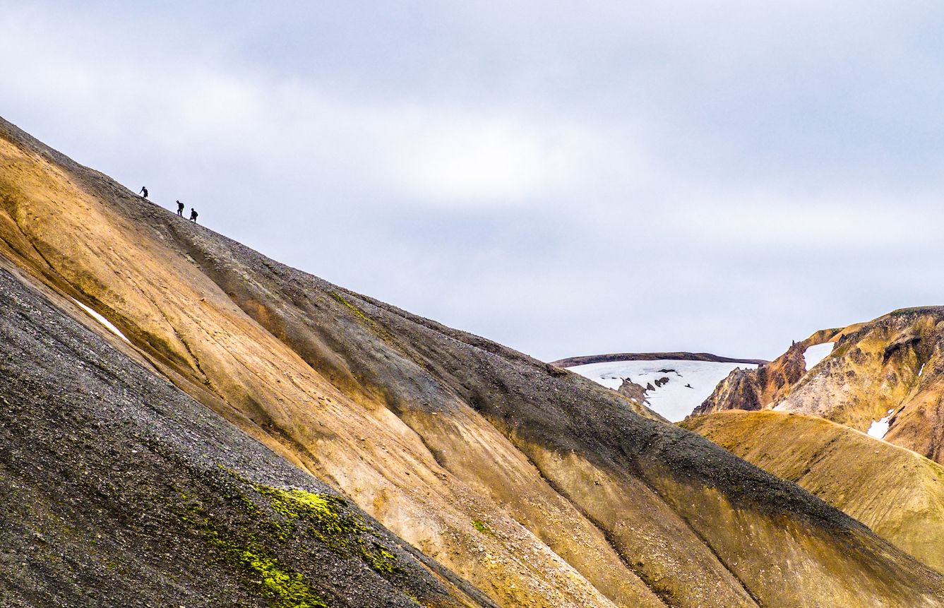 Hikers struggling up the steep climb leaving Landmannalaugar
