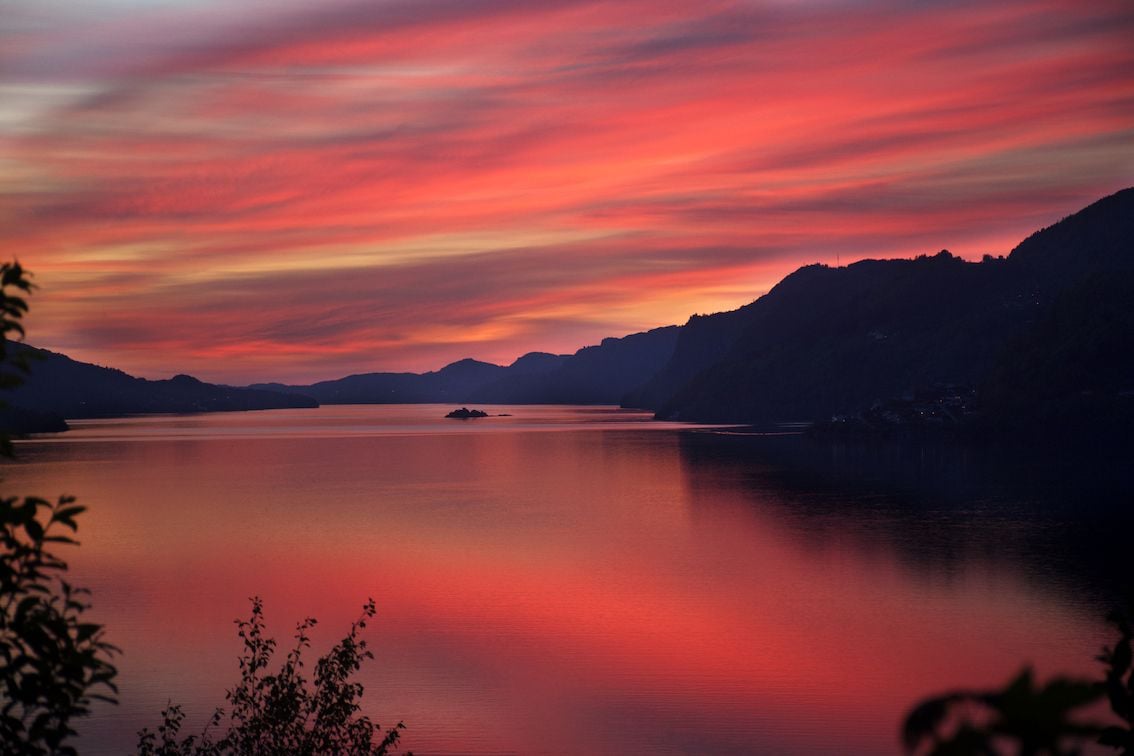 Midnight sun sunset over a lake in northern Norway.