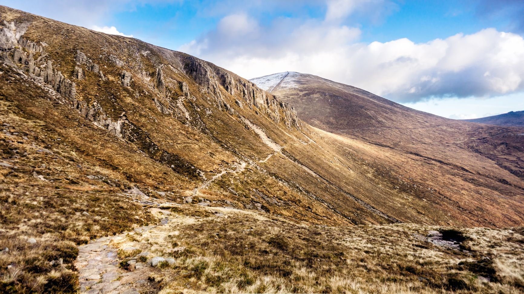 The trail up Slieve Donard, the highest mountain in Northern Ireland, on a sunny day