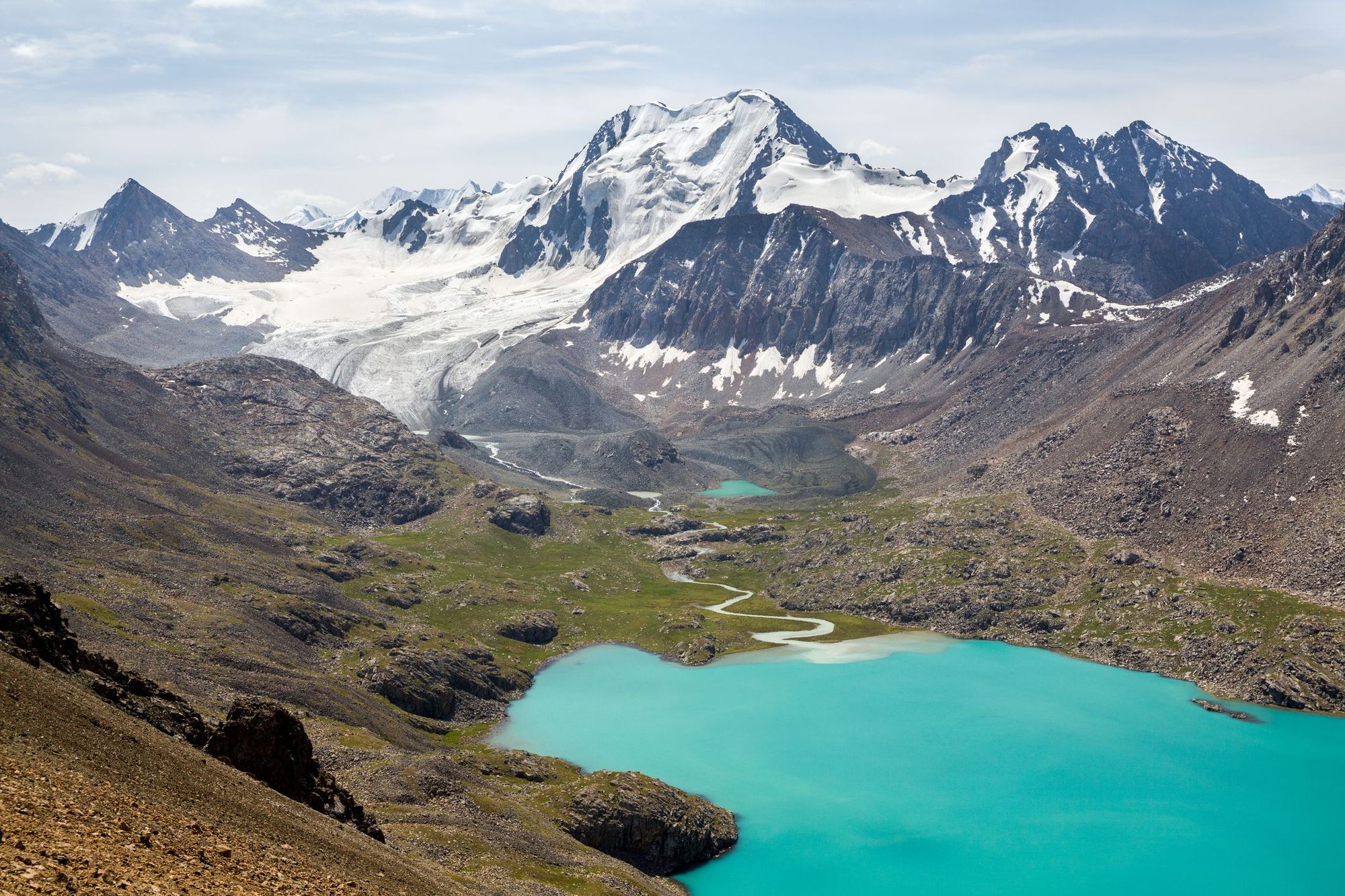 The brilliant blue Ala-Köl Lake in the Tian Shan mountains.