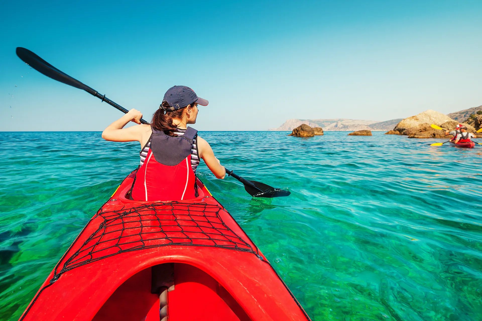 Female kayaker in the water.