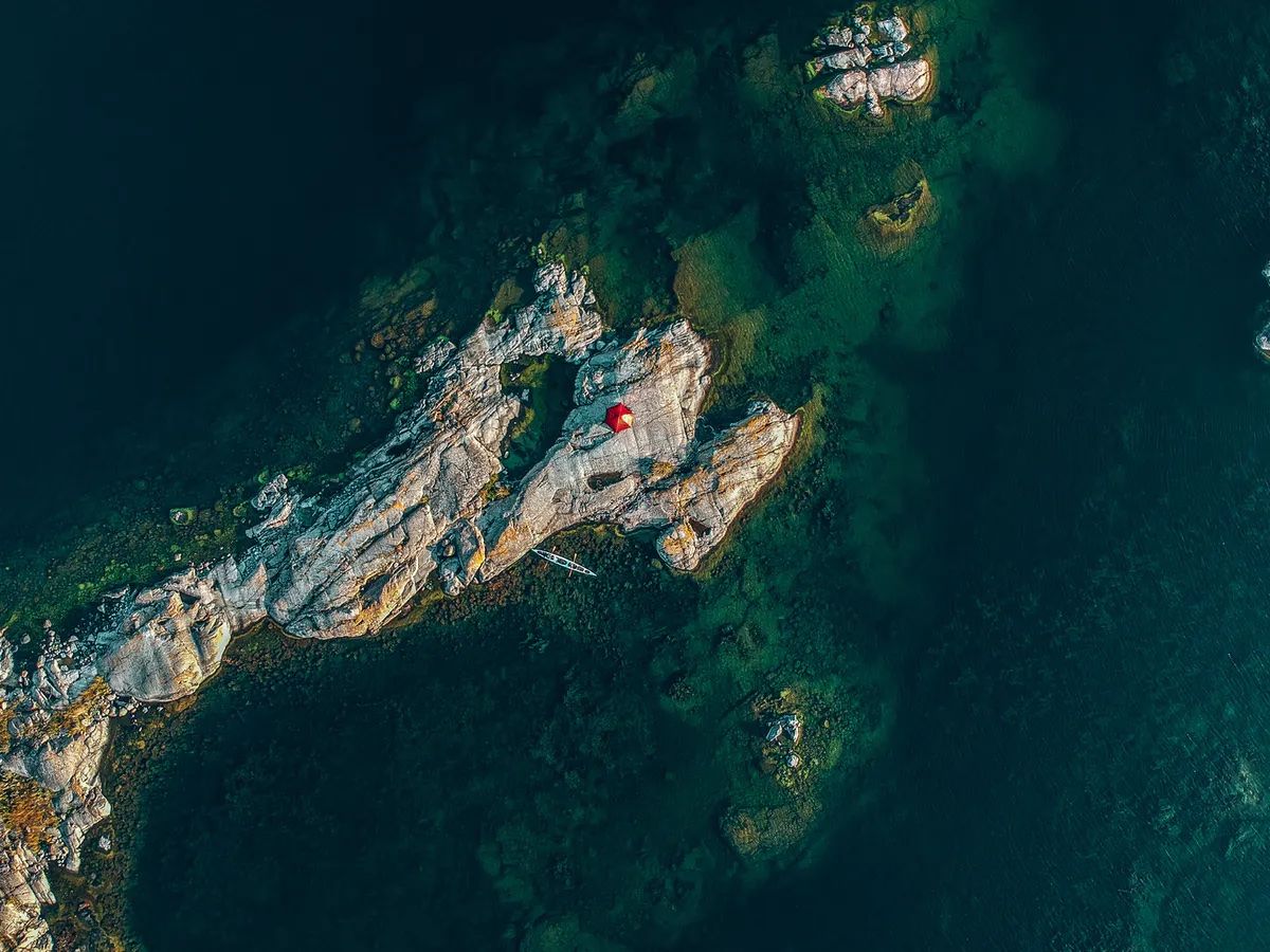 An aerial view of a kayak camp in Saint Anna Archipelago