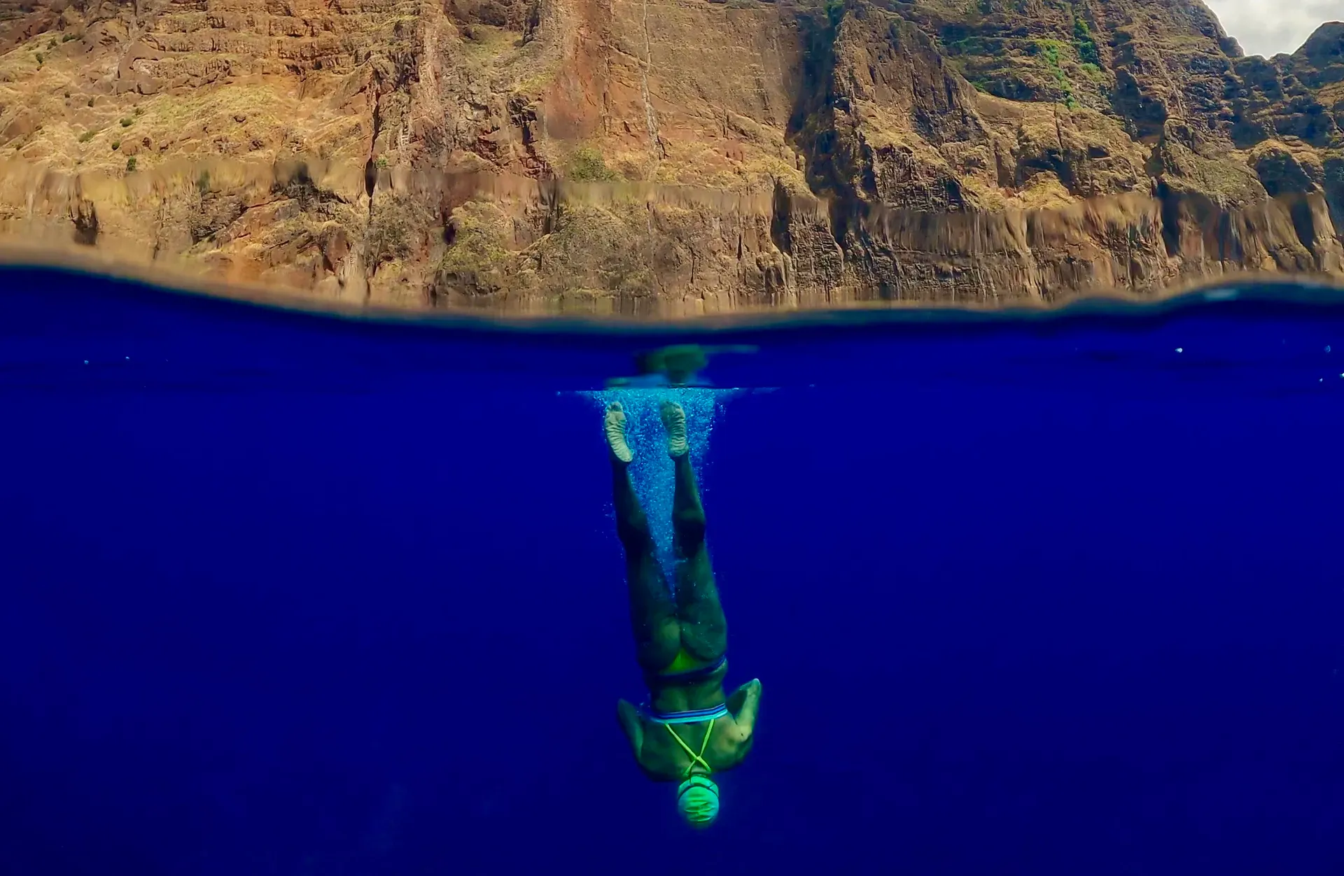 Woman diving into the deep blue sea
