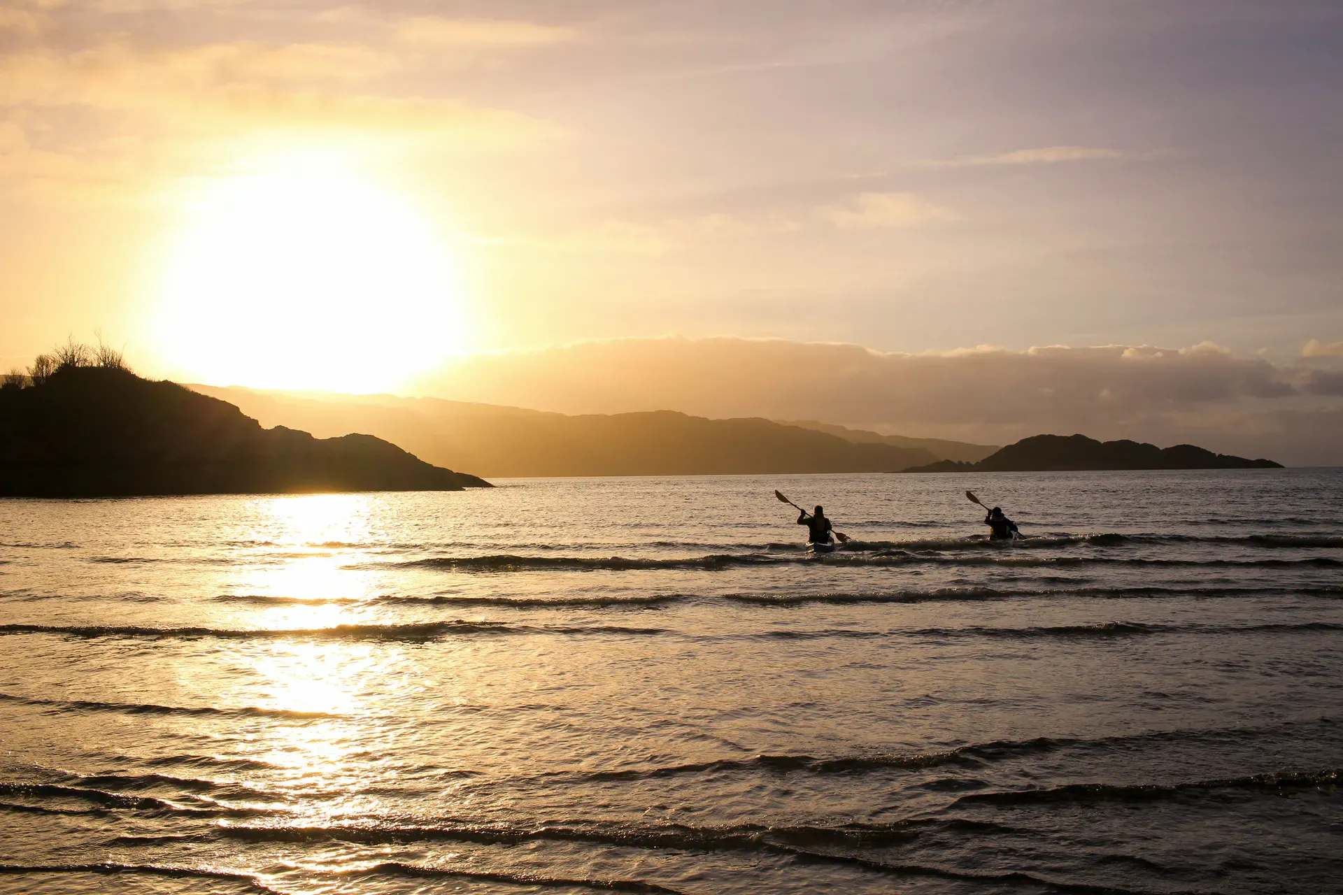 Kayakers at sunset