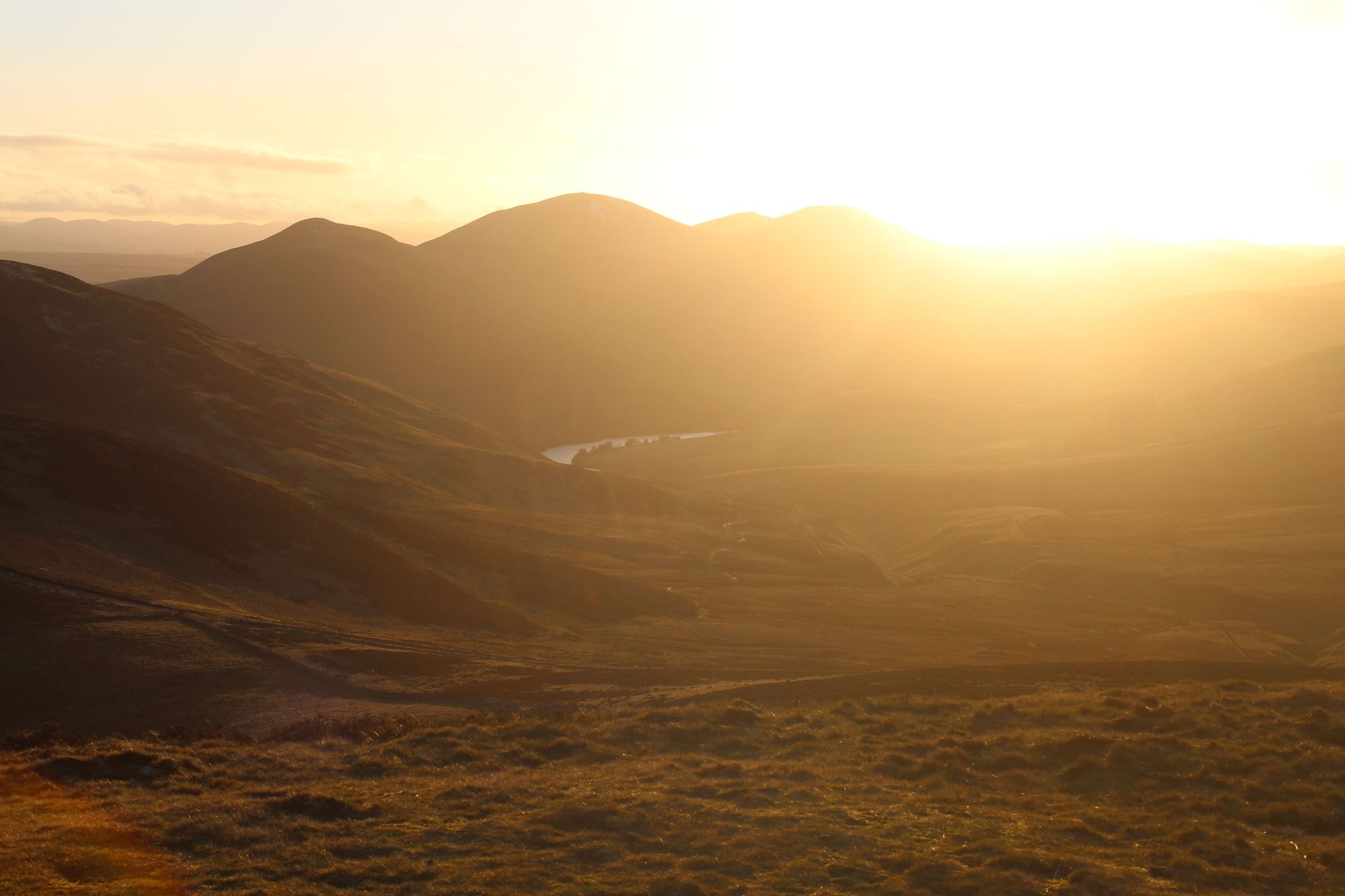 The sunset pictured from Allermuir, looking out over the five peaks of the Pentland Hills. Photo: Stuart Kenny
