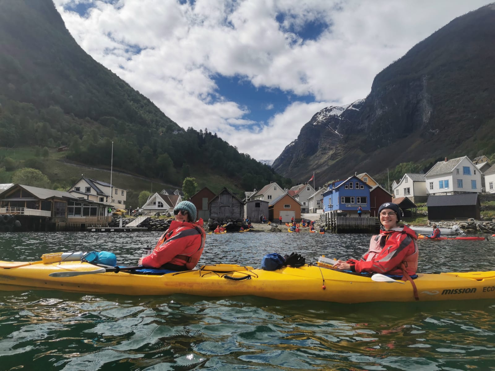 Two women kayakers in the Norwegian fjords.