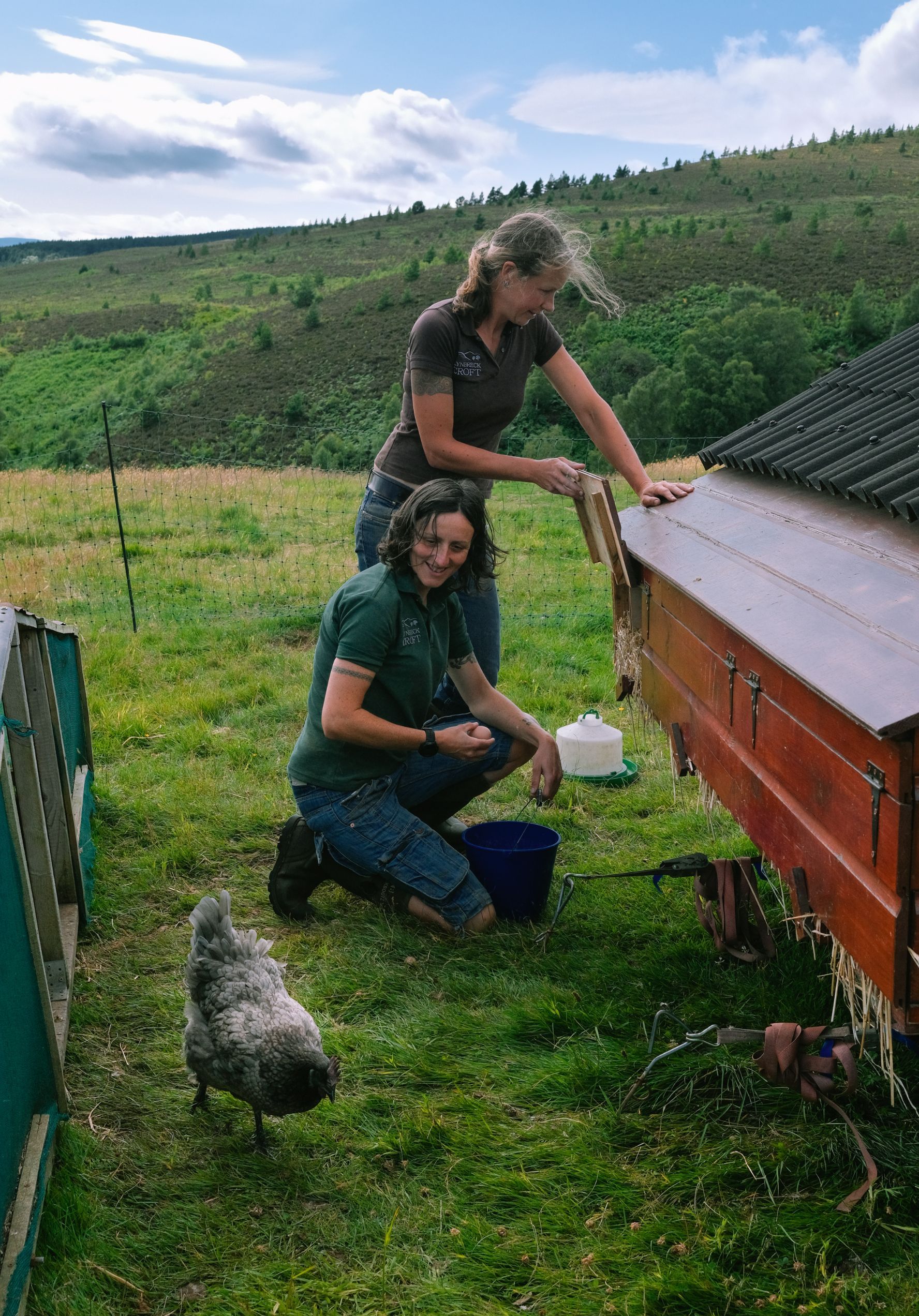 Sandra Baer and Lynn Cassells look after hens on their croft in the Scottish Highlands.