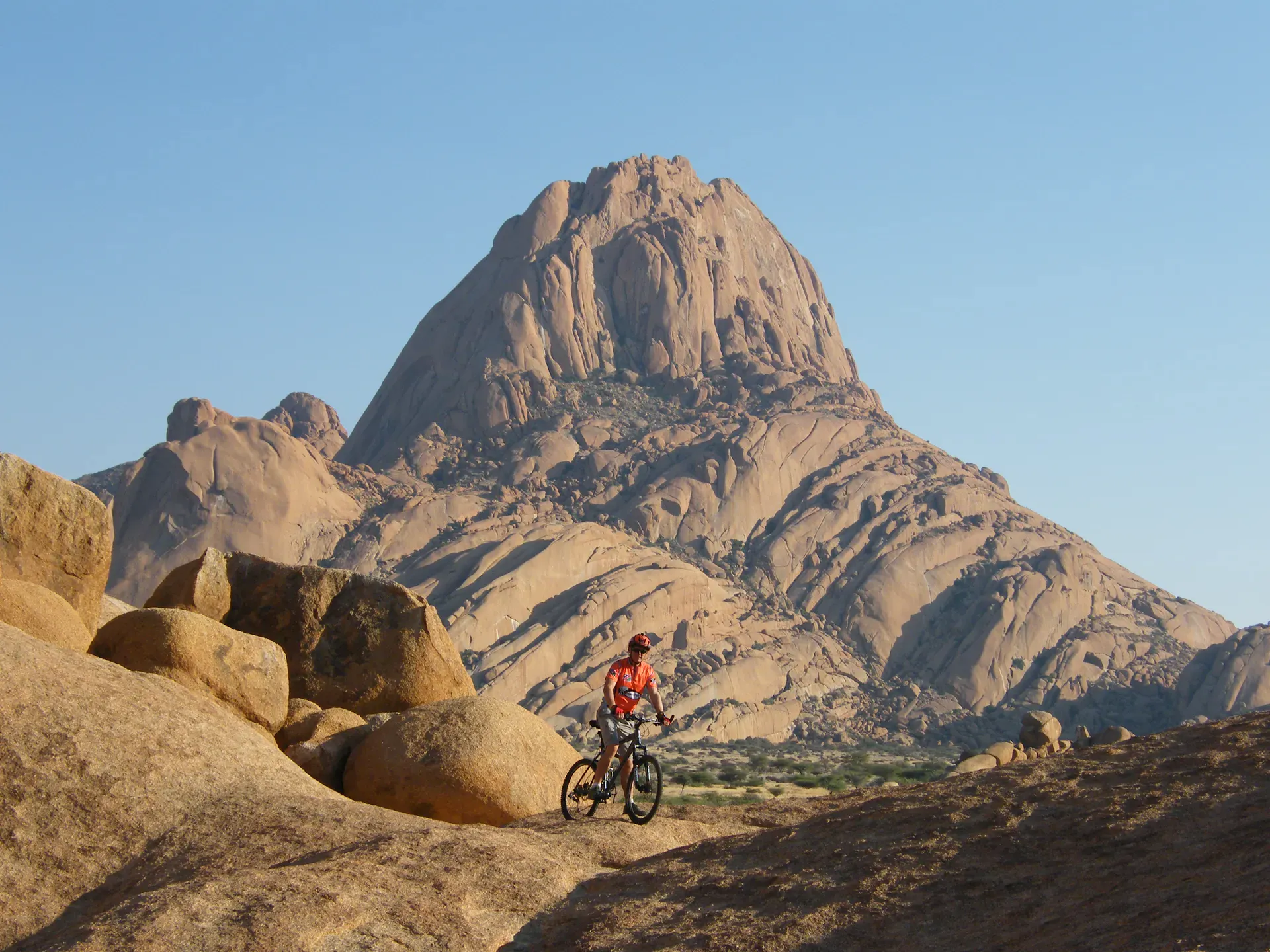 Cyclist in front of Spitzkoppe