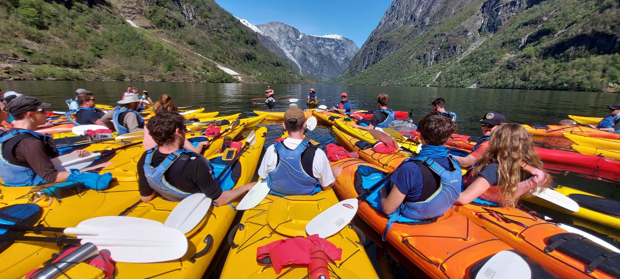 Kayakers receiving a safety briefing before their trip.