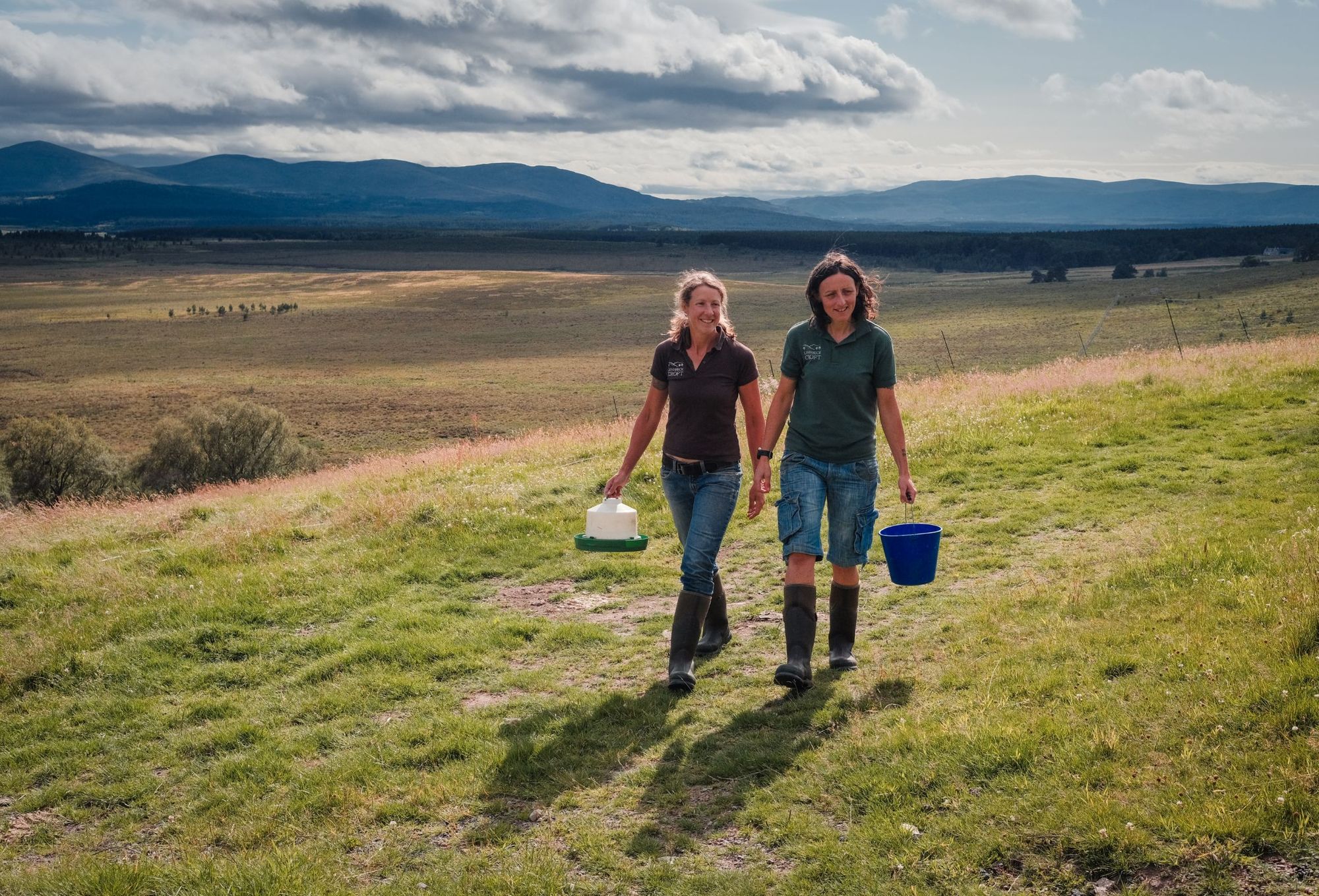 Sandra Baer and Lynn Cassells on their way to feed the chickens in their Highland croft.