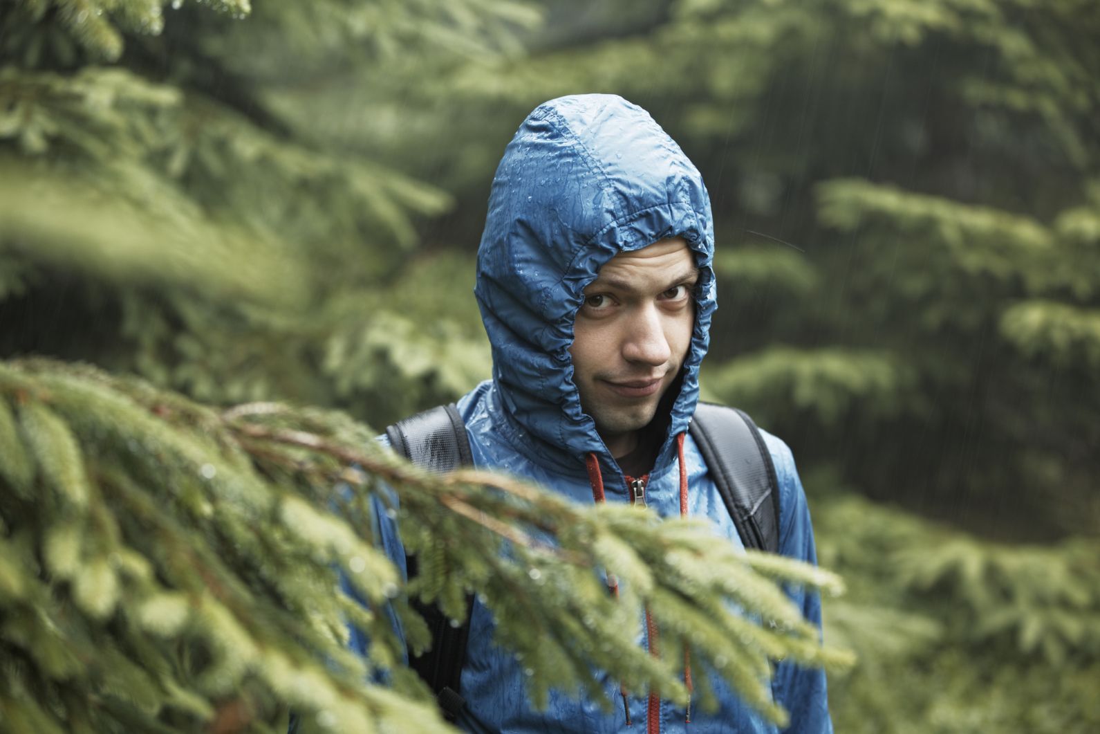 A newbie hiker with a raincoat looking slightly unhappy.