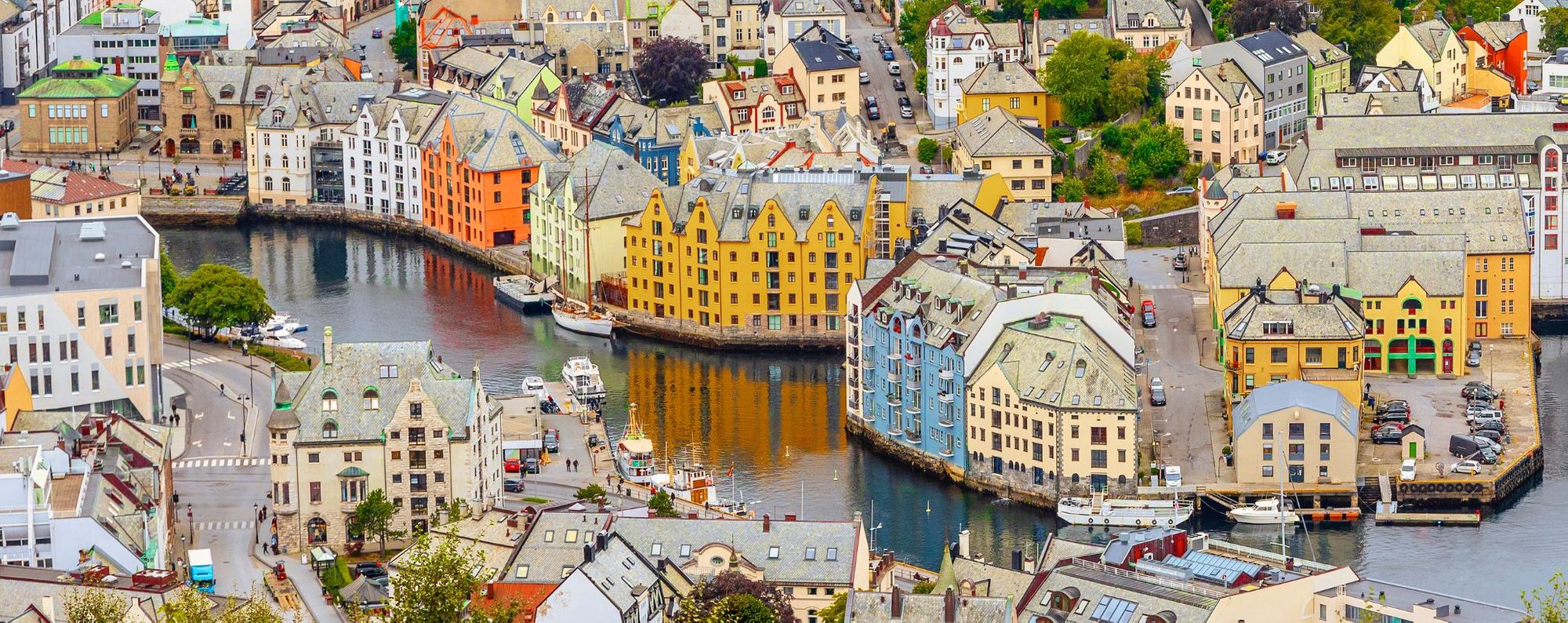 an aerial view of Bergen, and the river which winds through the city.