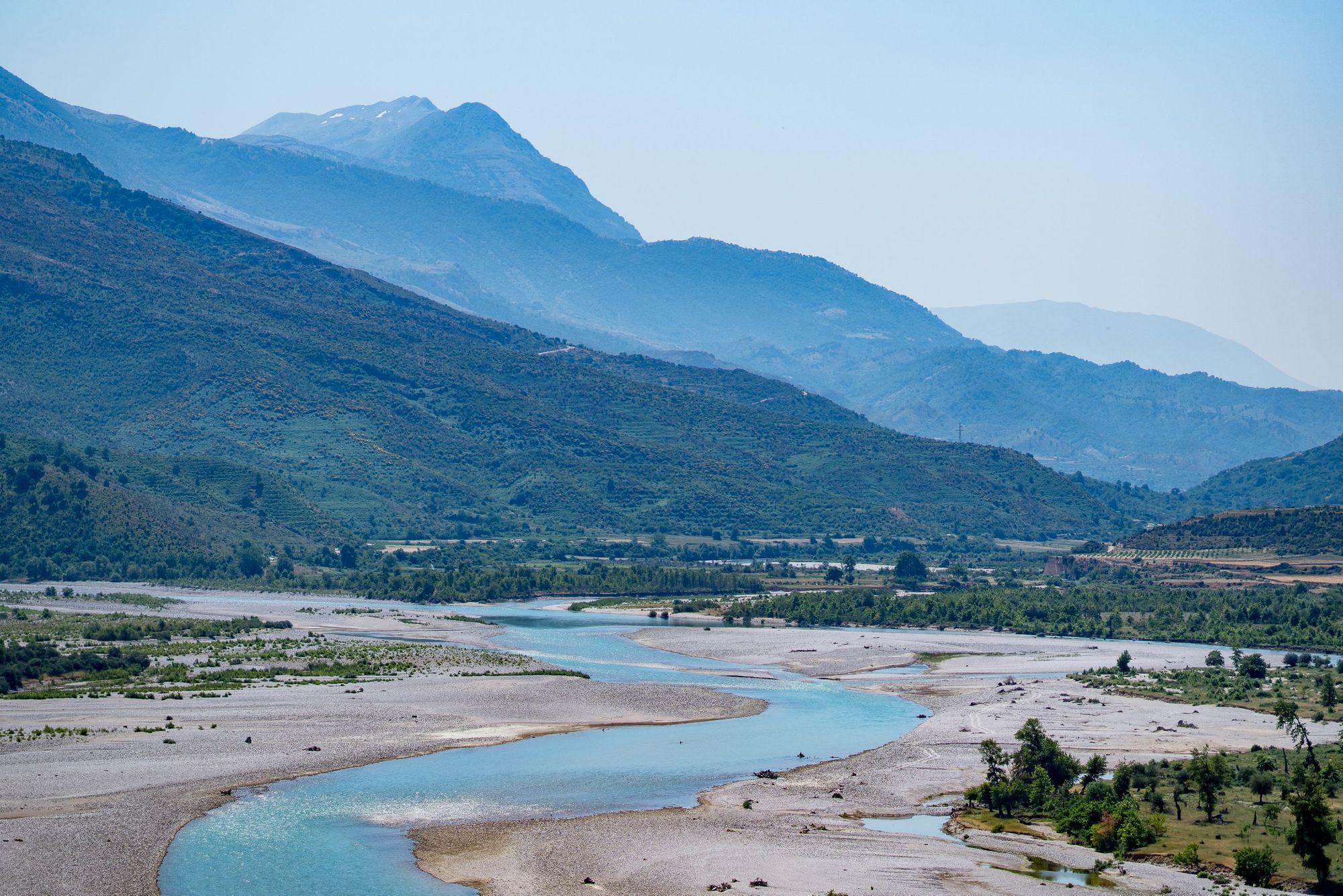 The beautiful twists and turns of the Vjosa, backdropped by the layering mountains. Photo: Hannah Bailey