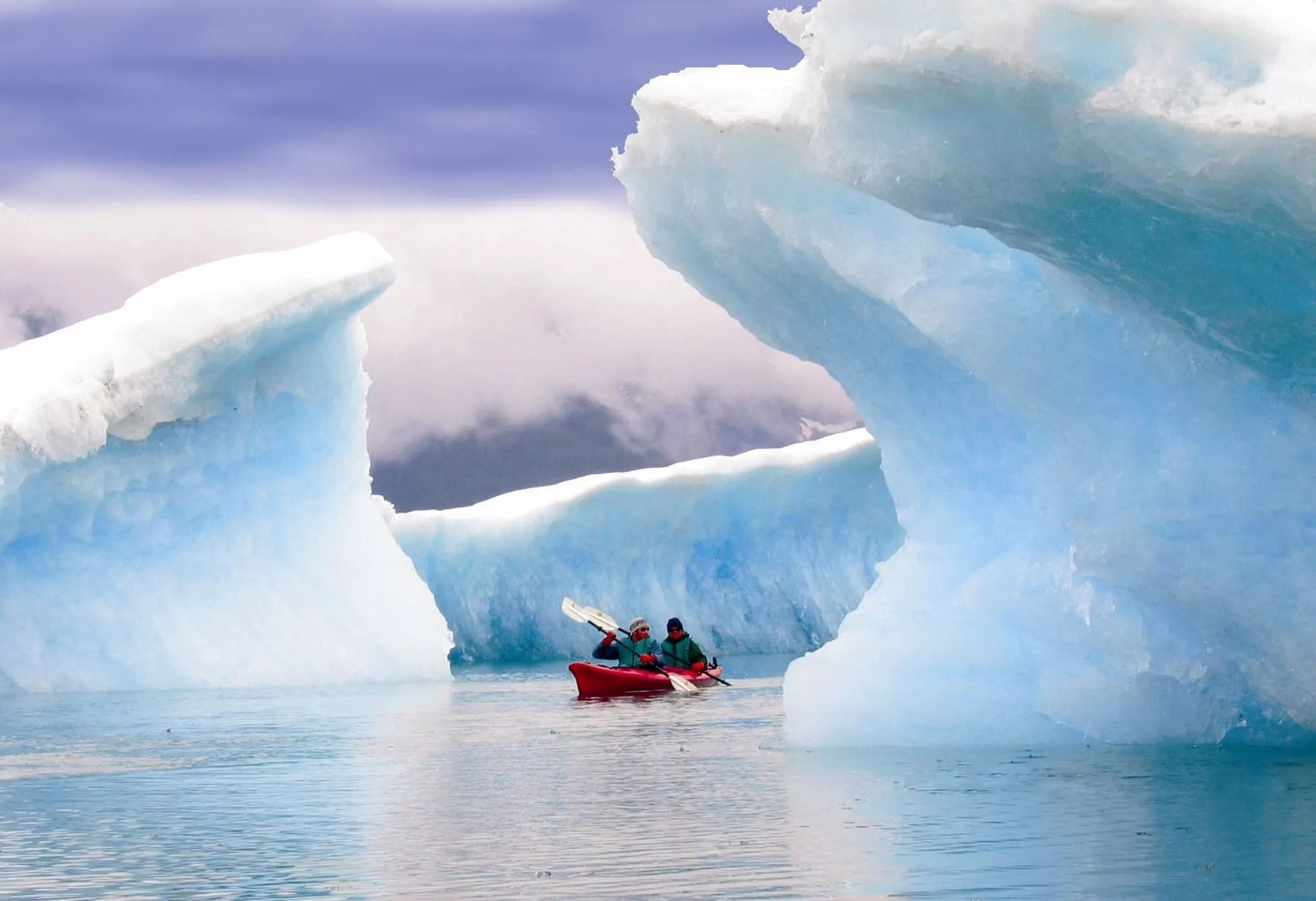 Kayaking through icebergs at Columbia Glacier, Alaska.