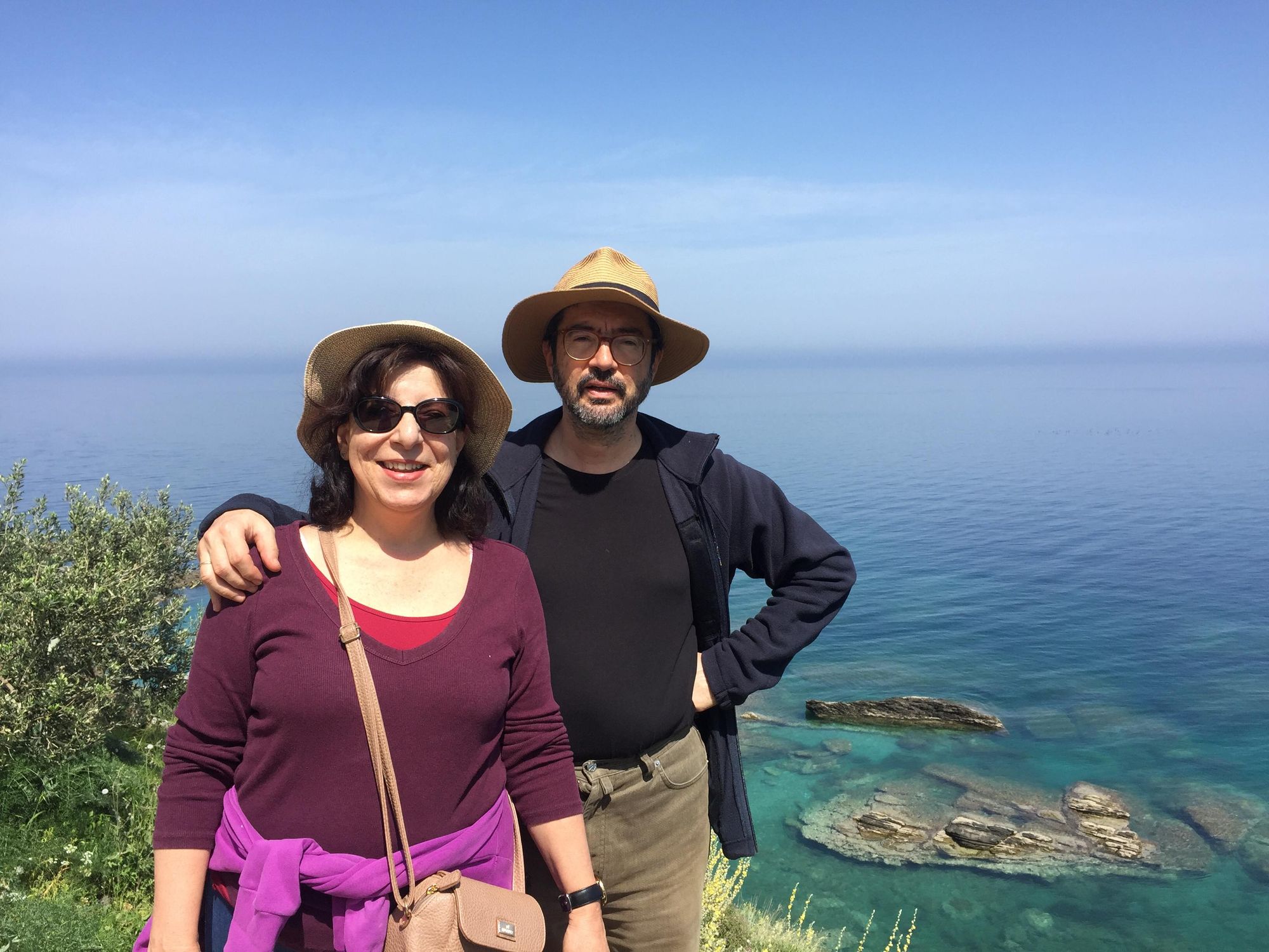 Man and woman by the sea in Greece.