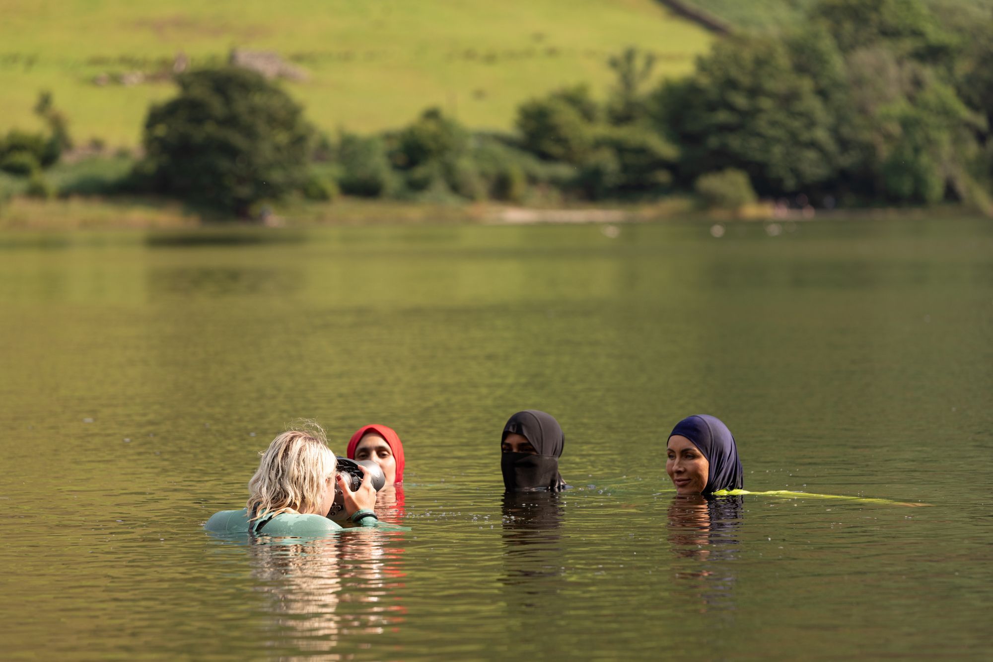 A woman photographs Muslim women swimming in the Lake District, a behind the scenes shot of I Am Capable