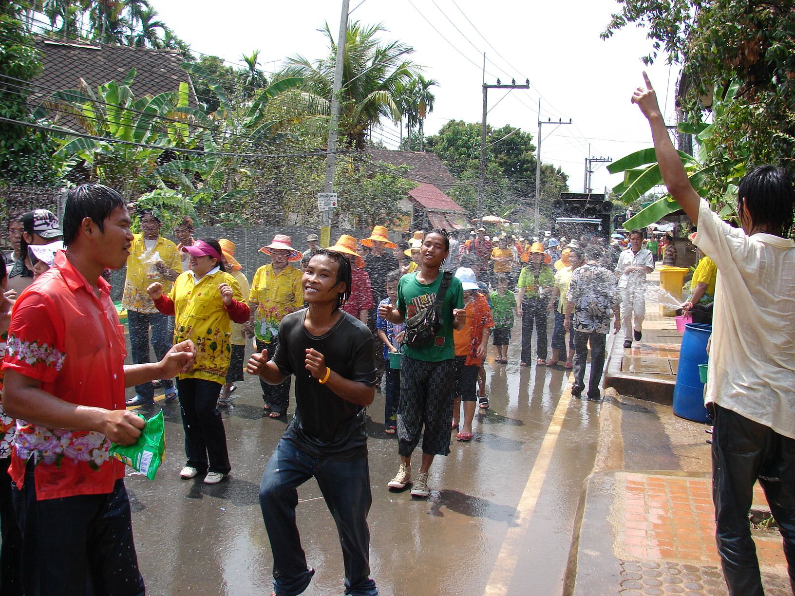 People enjoying the Songkran water fight, in Thailand.