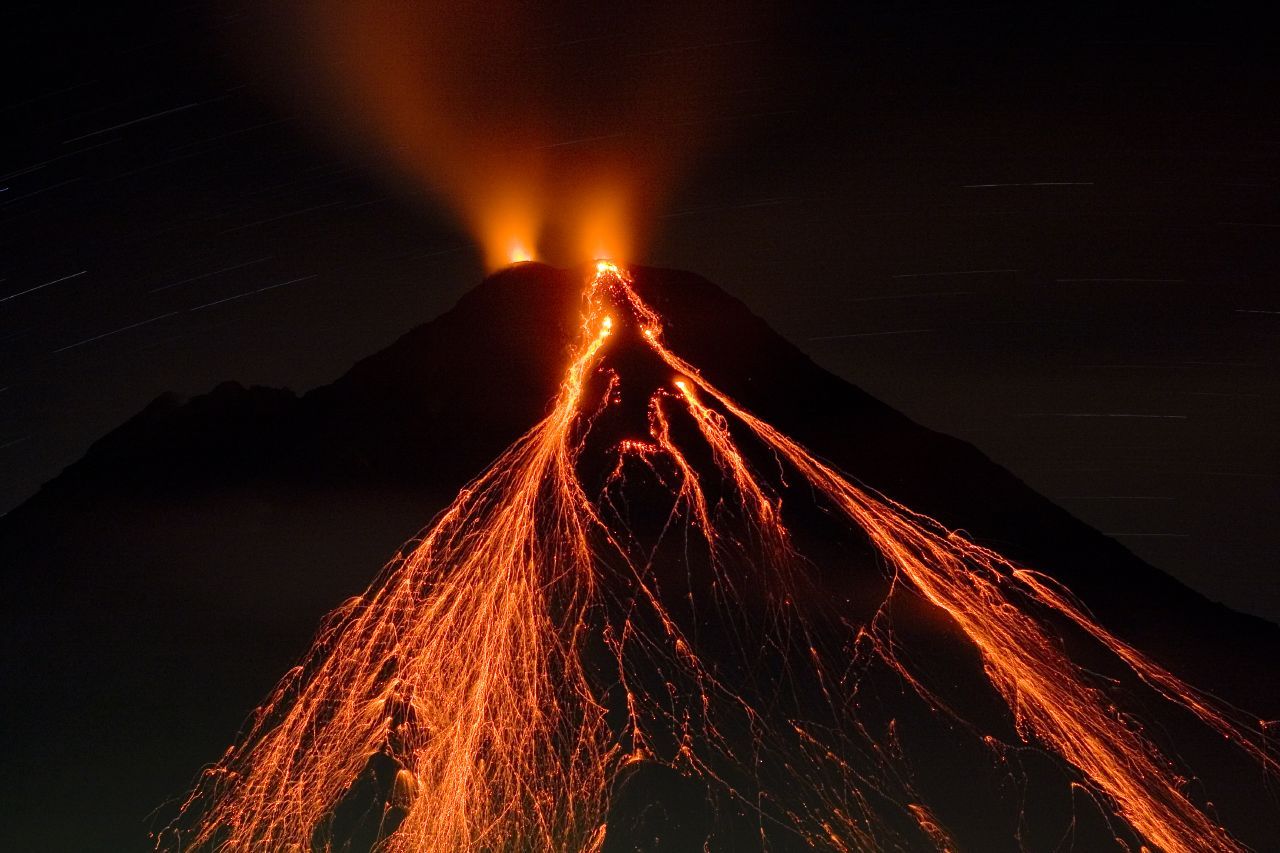Arenal Volcano, Costa Rica, at night - fire and lava coming from the crater