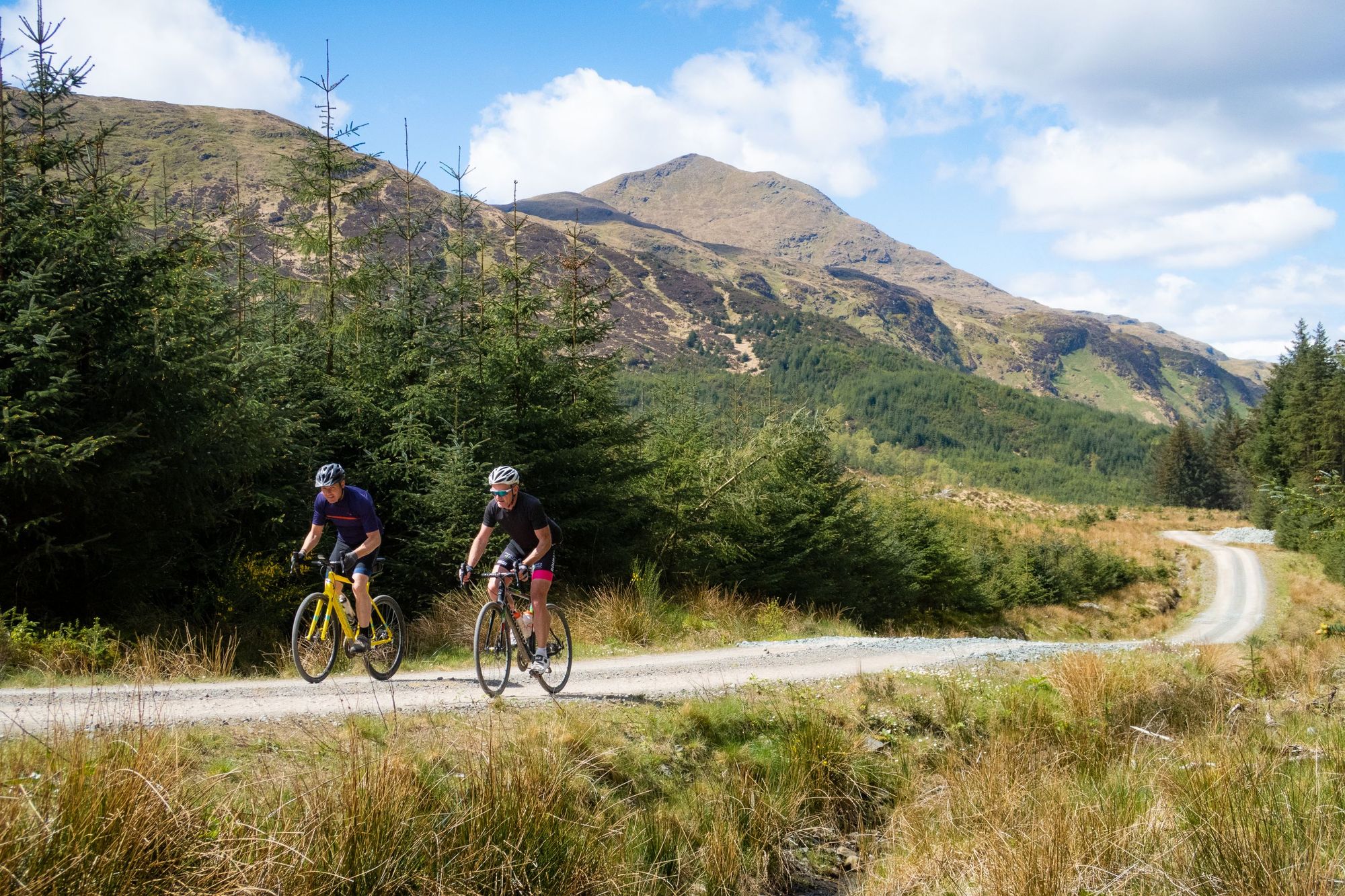 Two cyclists taking in typically Scottish scenery on the beautiful gravel trails of Aberfoyle. Photo: Stu Thompson