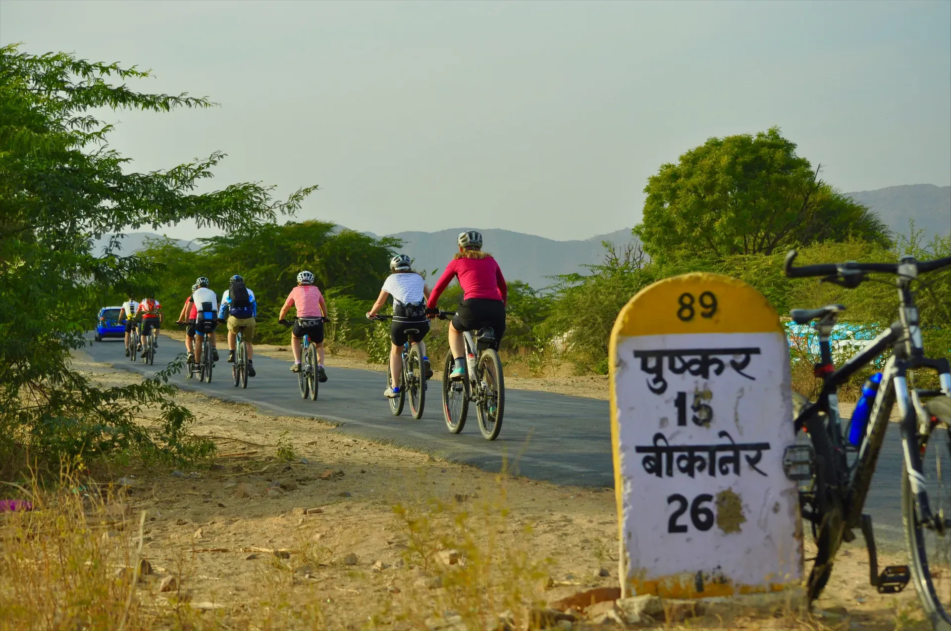 Cyclists on a quiet road in Rajasthan, India.
