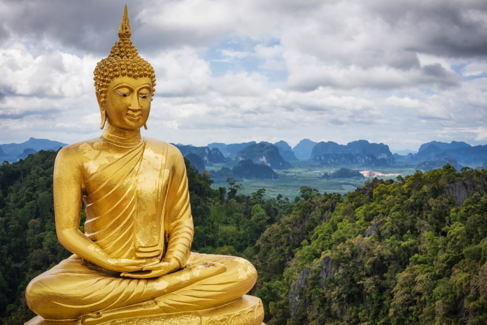 The enormous Buddha at the Tiger Cave Temple, backdropped by Krabi and the Kiriwong Valley