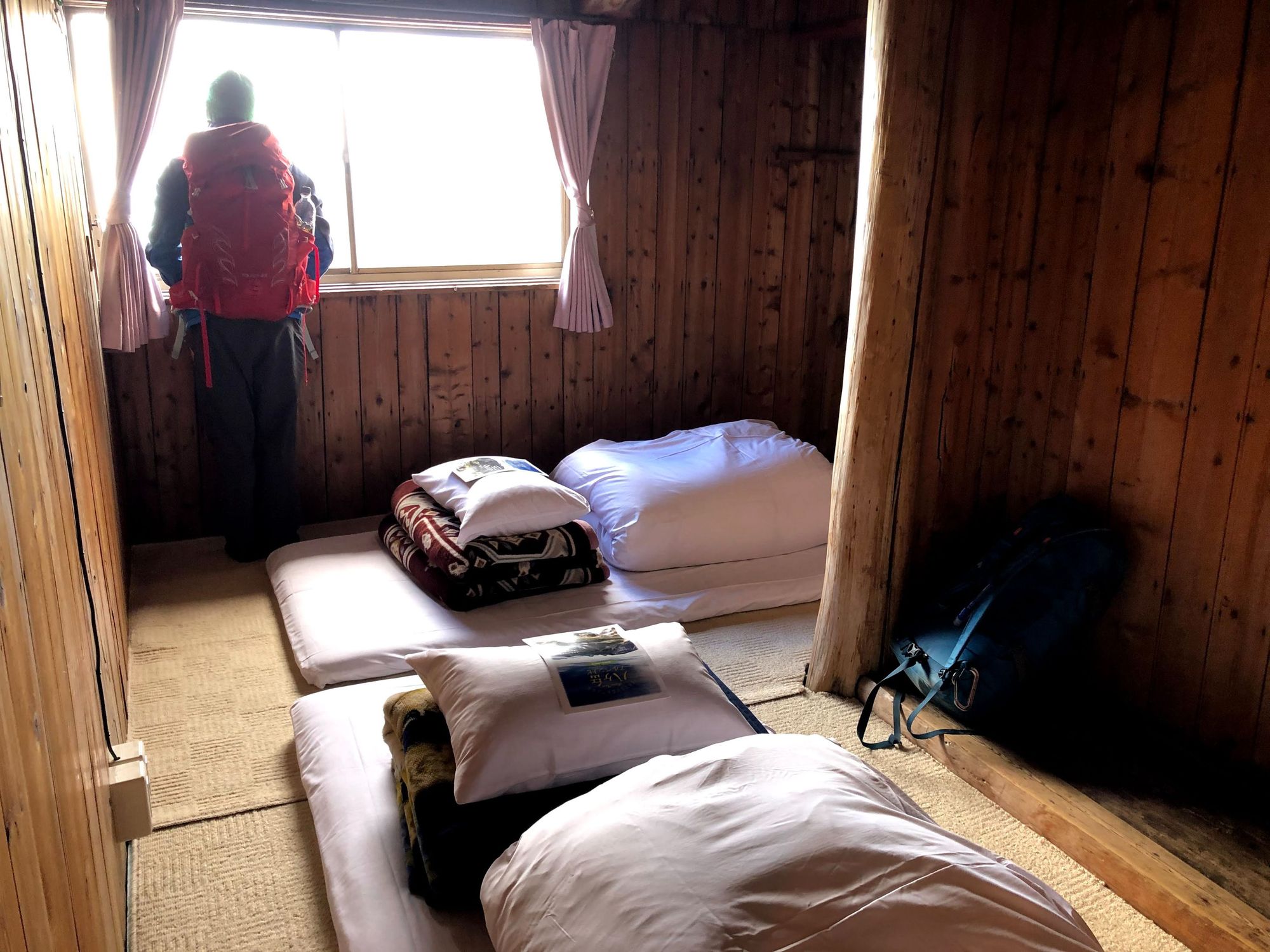 A dormitory in a Japanese mountain hut, with tatami sleeping mats