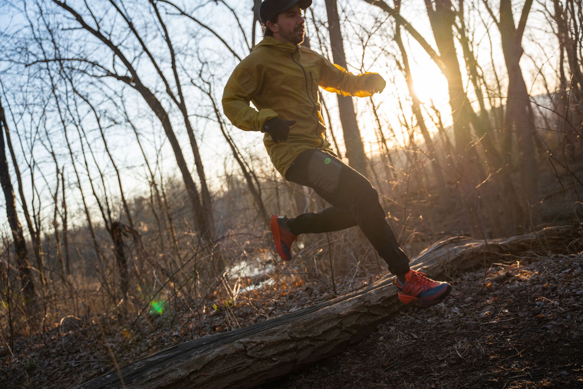 A runner on the trail in the woods