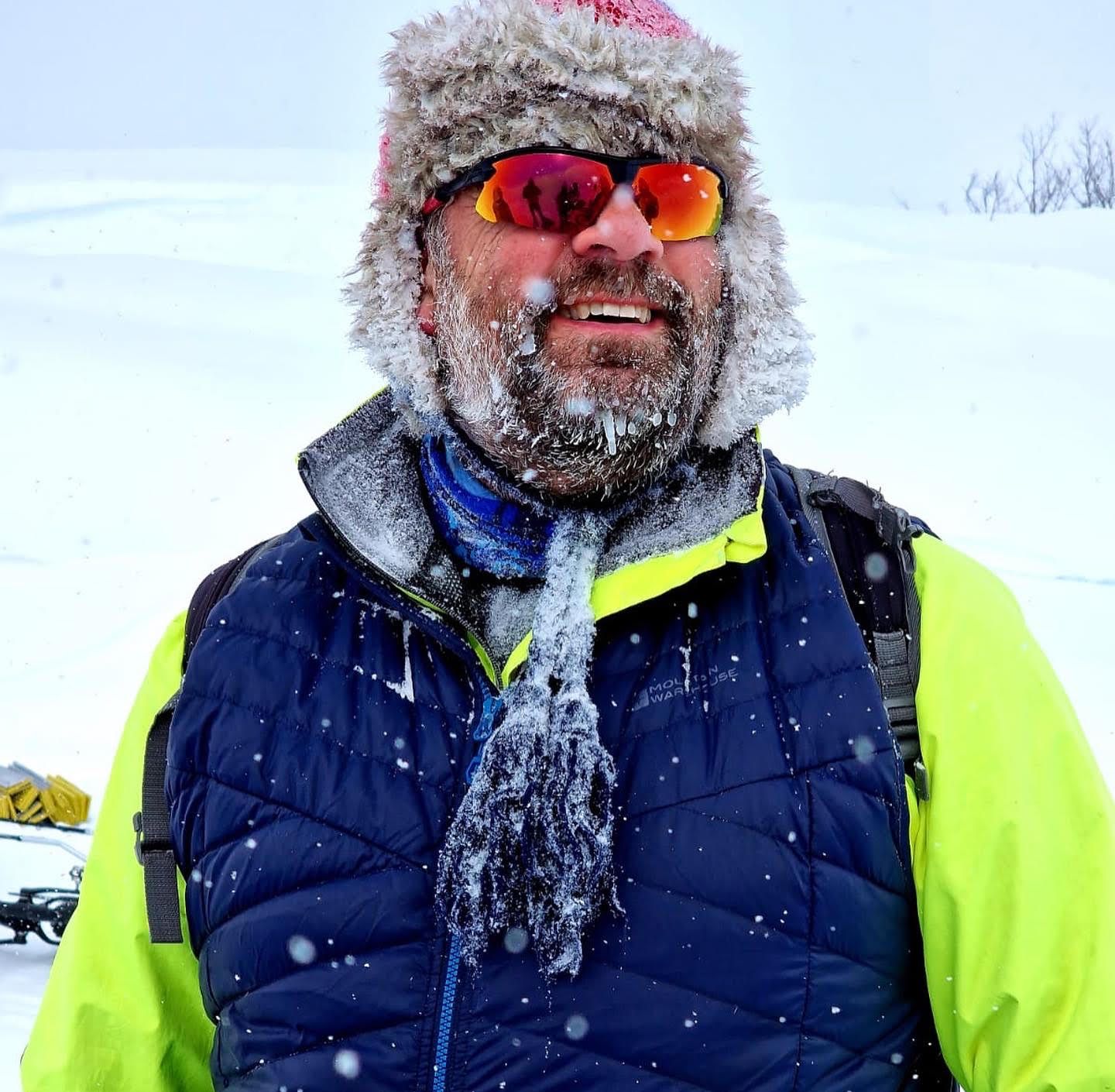 Andy in the Arctic, surrounded by ice crystals in the air.