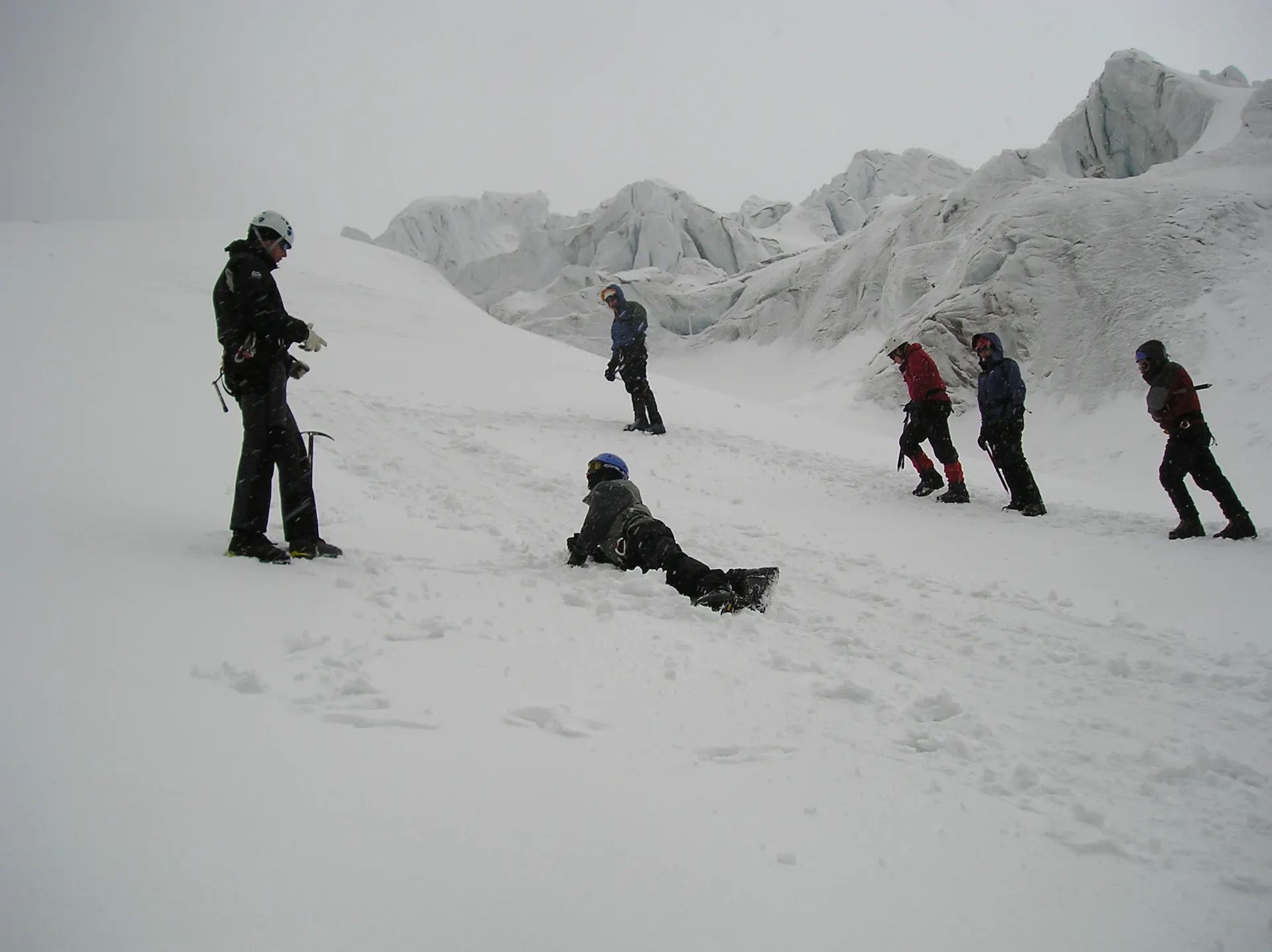 A group of climbers doing glacier skills near Jose Rivas Refuge, Ecuador.