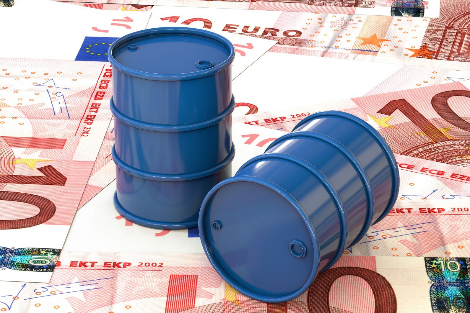 Two miniature barrels of oil sit on top of a floor of Euros.