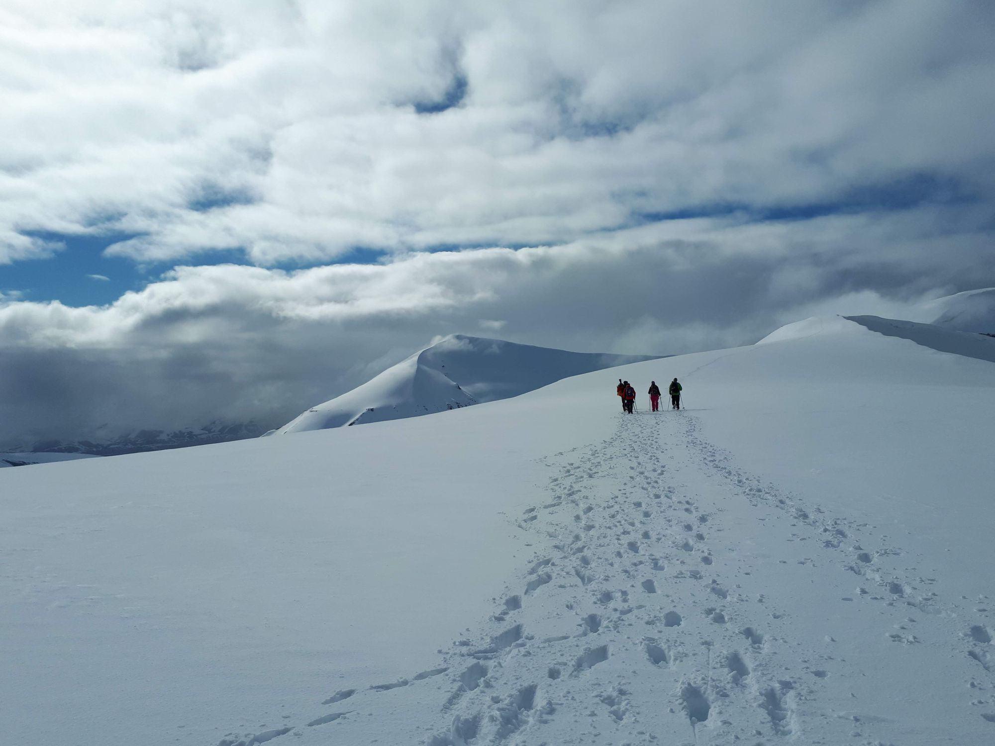 A group of hikers in the snow near Longyearbyen, Svalbard.