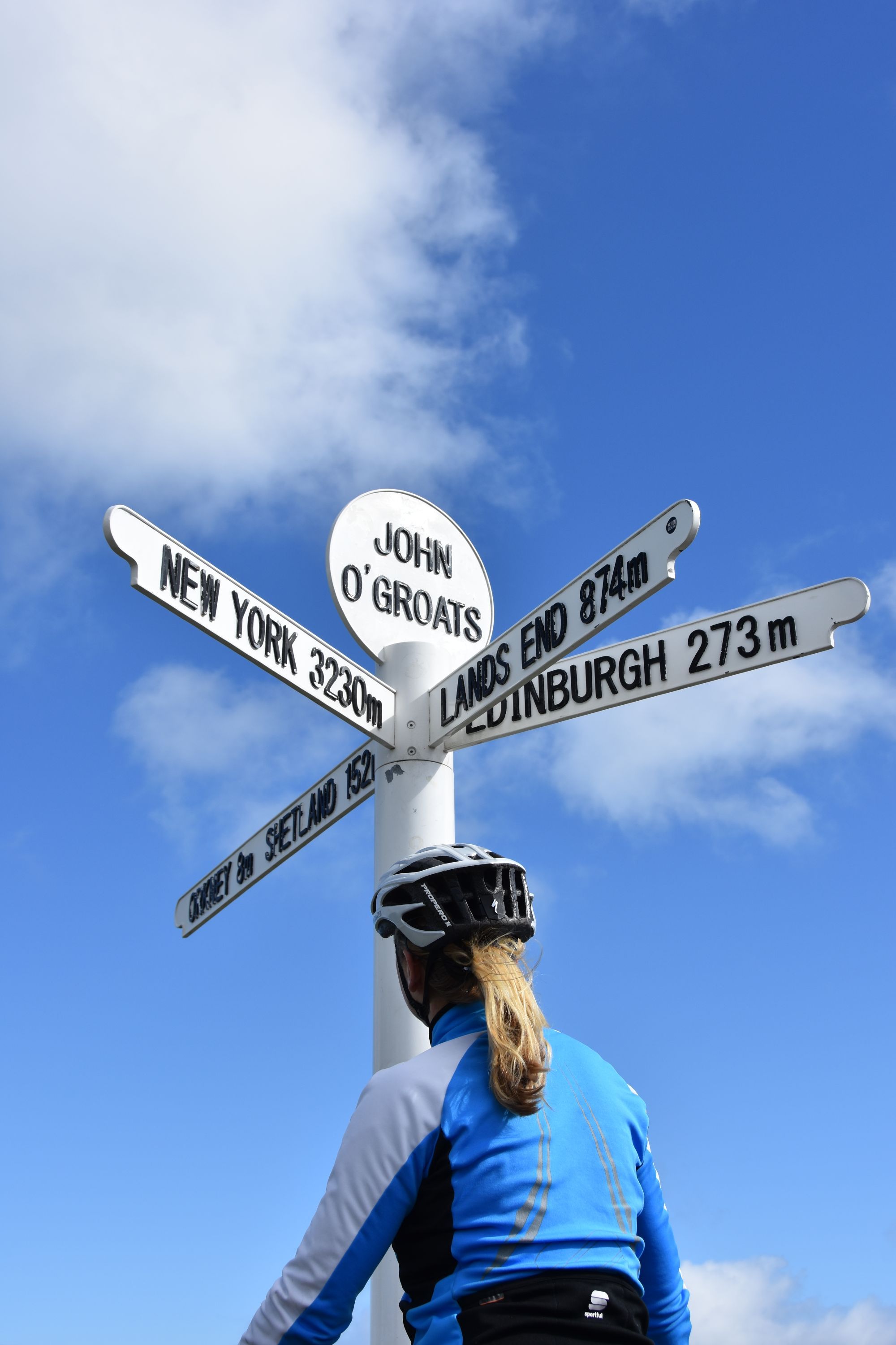 Hannah Reynolds at the final signpost on the Land's End to John o' Groats long-distance epic. Photo: John Walsh.