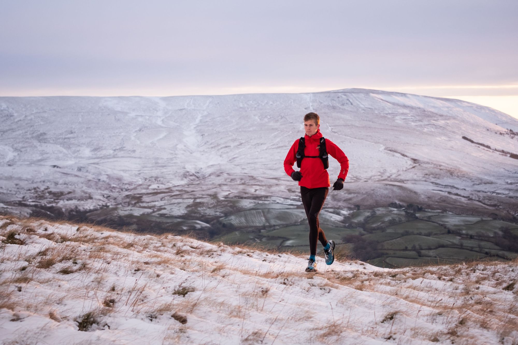 Adventurer Alex Stanisforth, who is also the co-founder of mental health charity Mind Over Mountains, running in the snow. Photo: Daniel Toal
