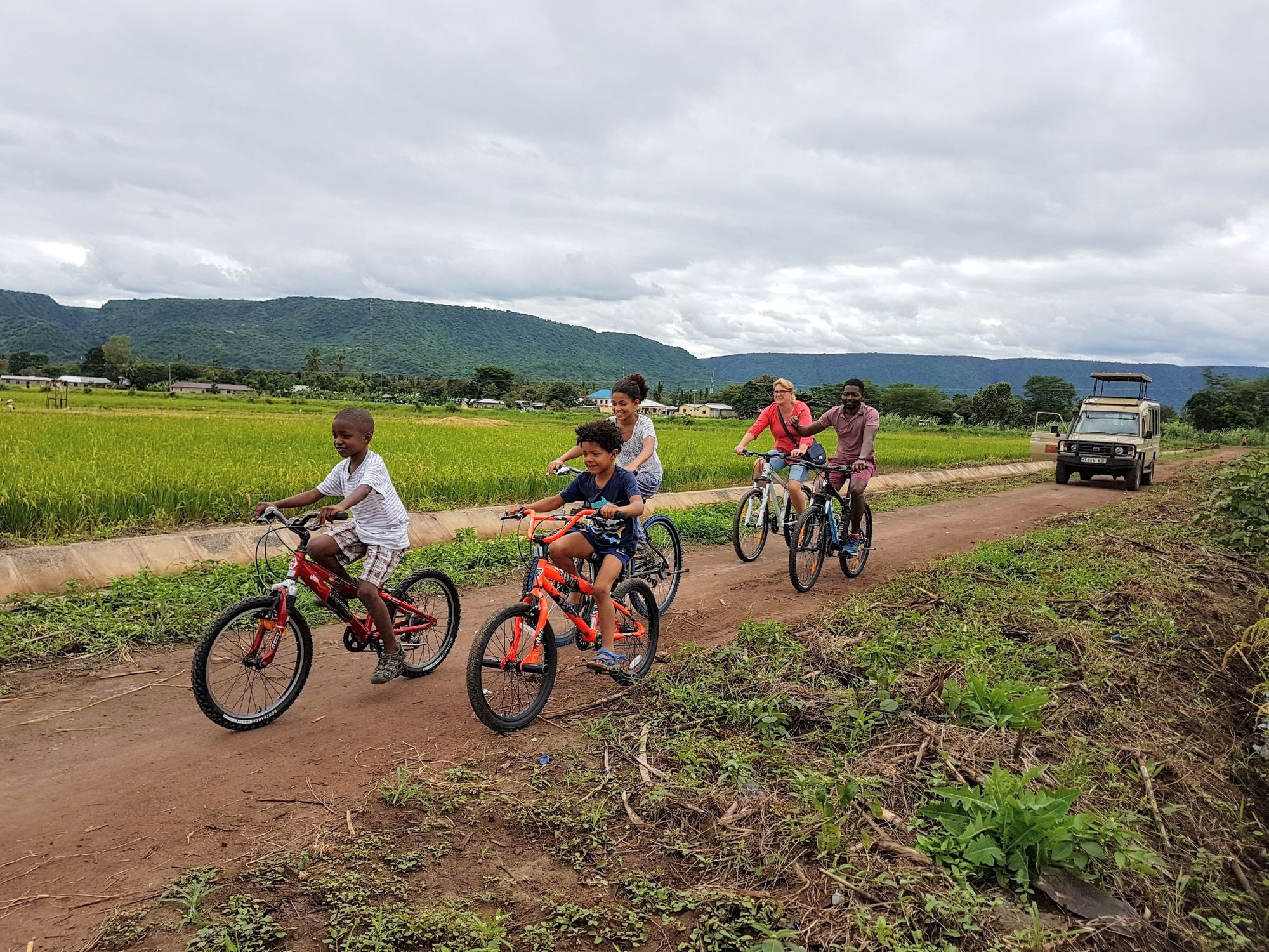 A family going out for a cycle ride in Tanzania.