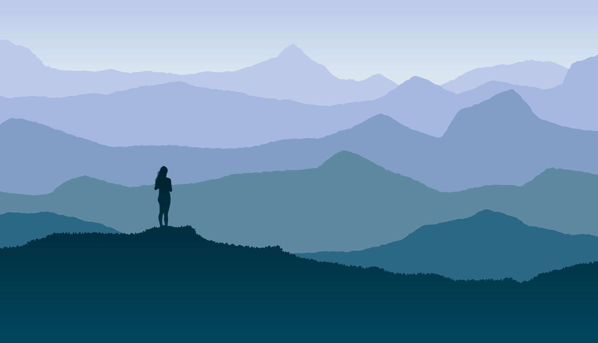 A silhouette of a woman staring at the mountains.